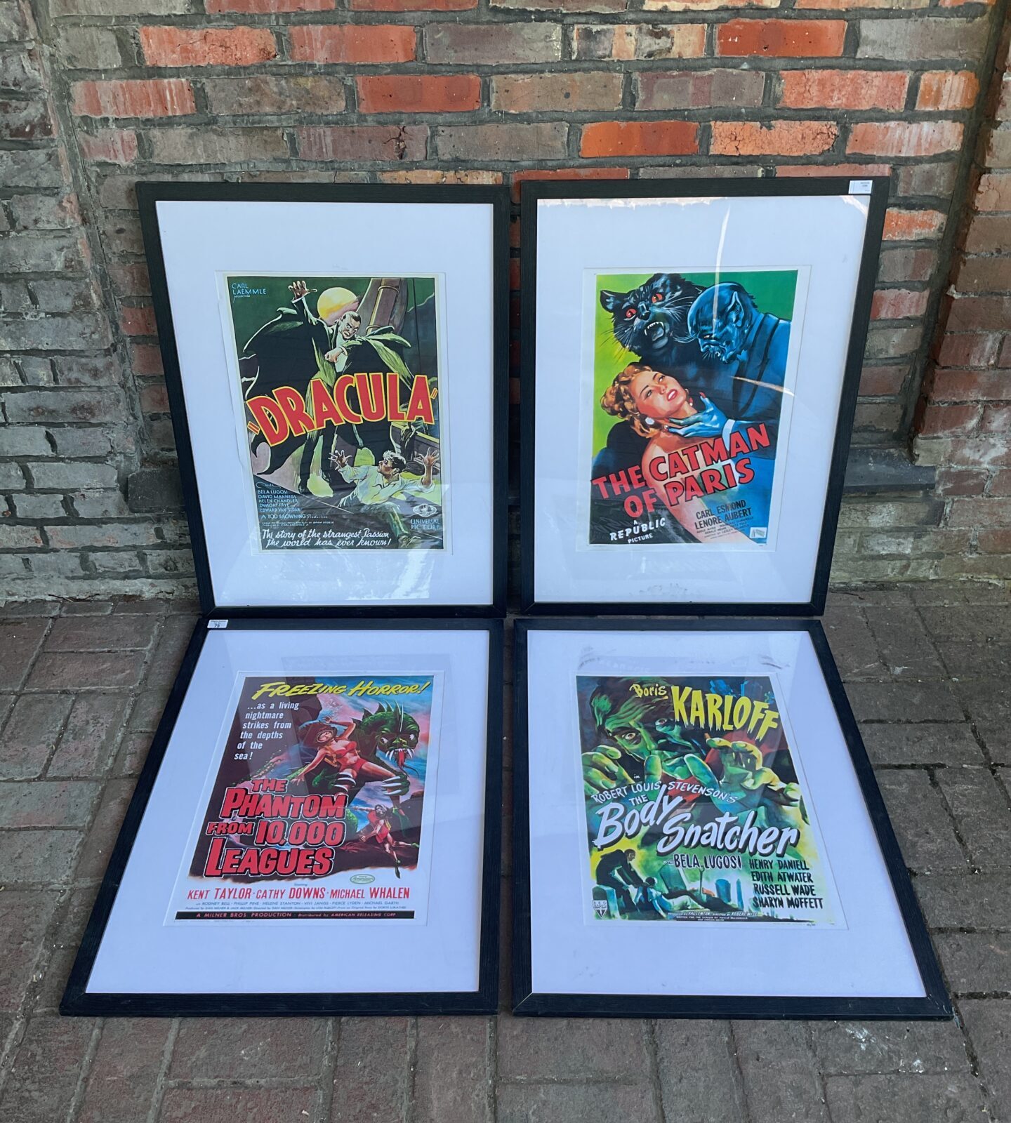 Set of four framed horror movie poster prints including dracula