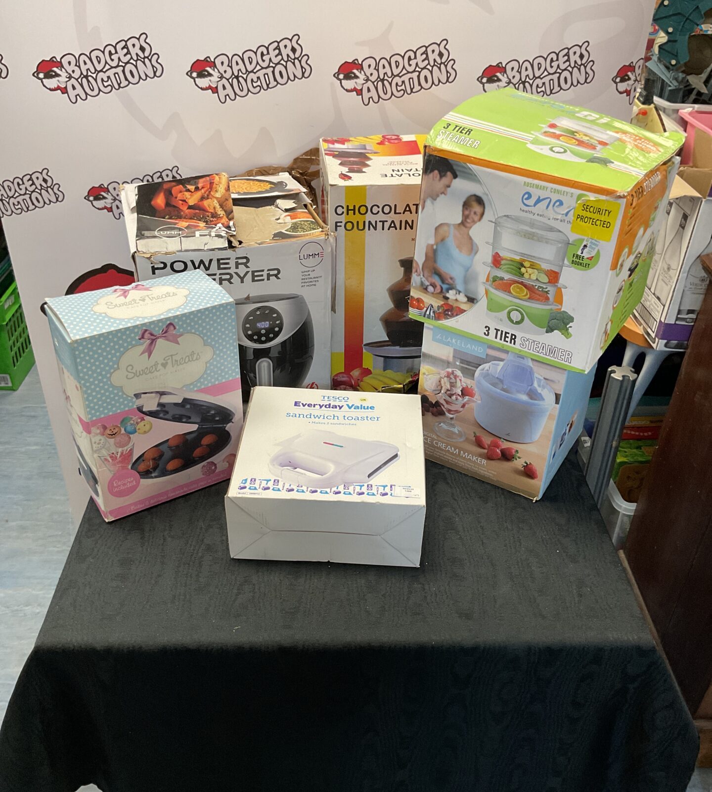 Selection of boxed kitchenware items inc air fryer, chocolate fountain and tesco sandwich toaster