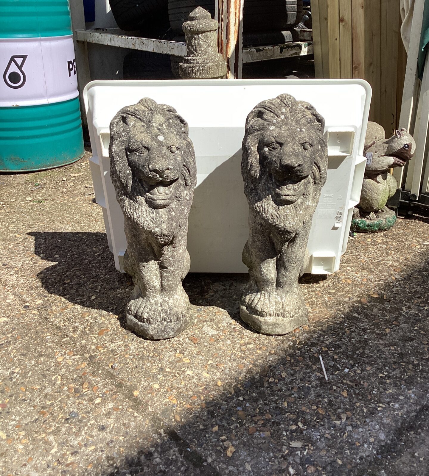 Two stone effect garden lion ornaments