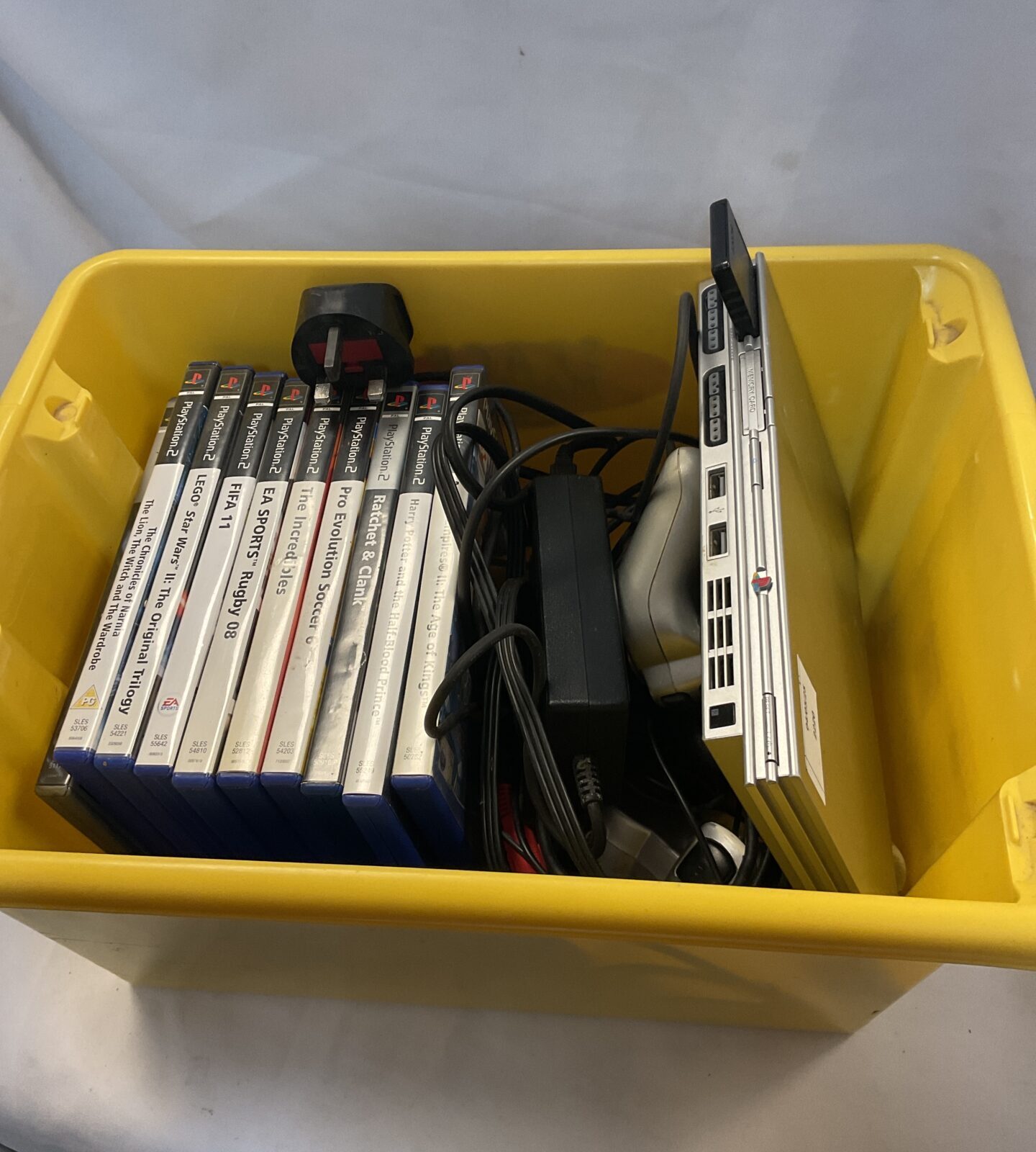 Silver sony PlayStation 2 slim console bundle