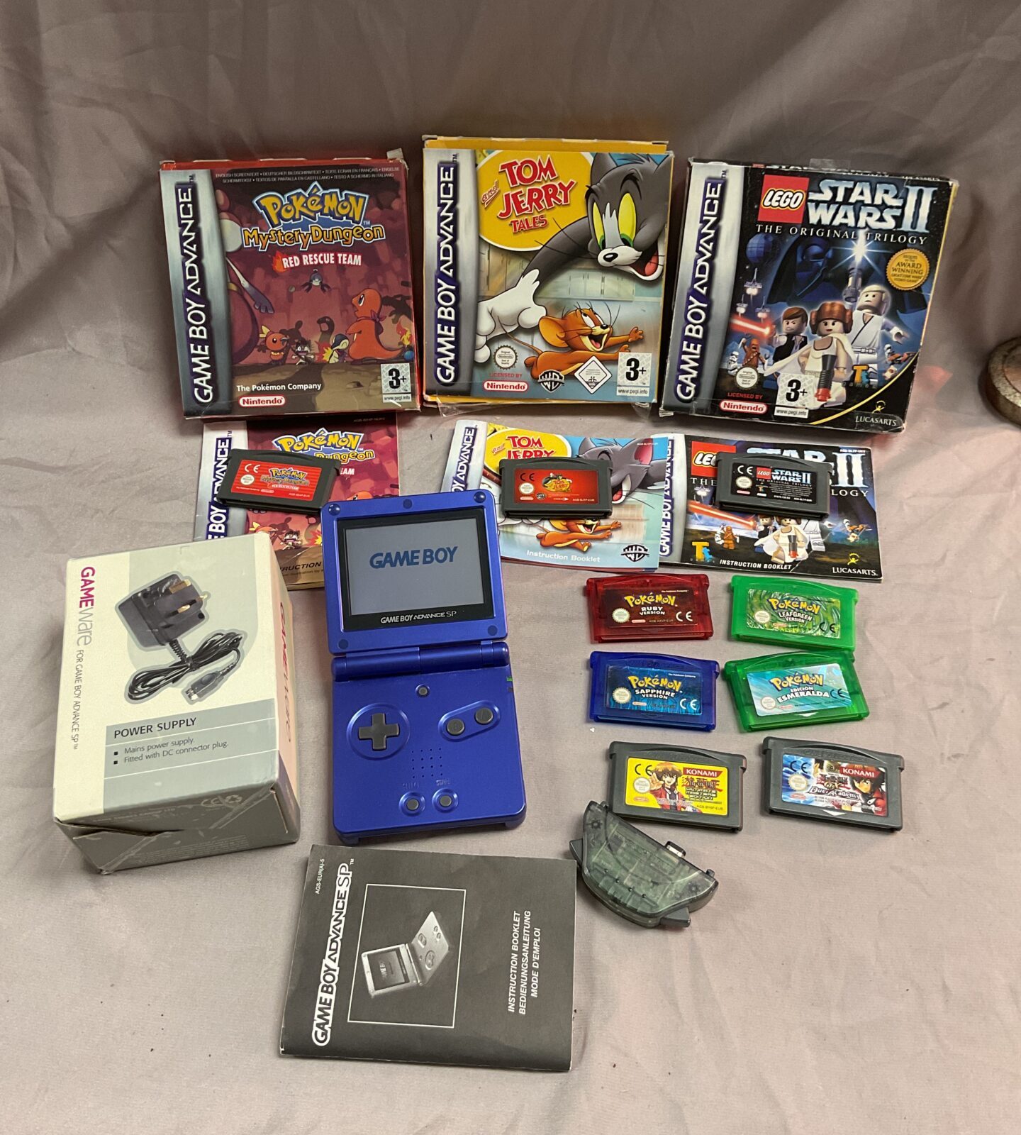 Nintendo Gameboy advance with assortment of games and power supply
