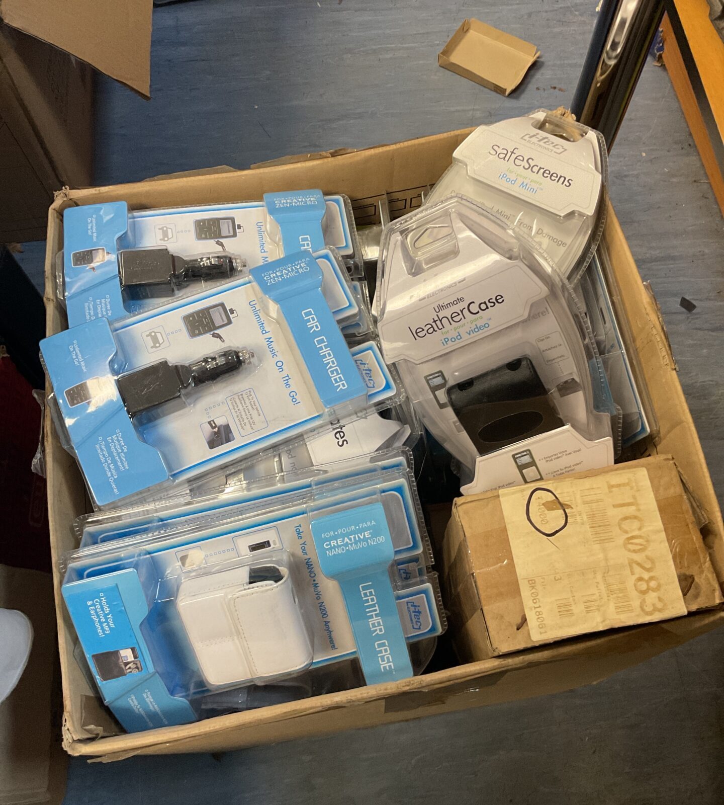 Large box full of new itec iPod accessories