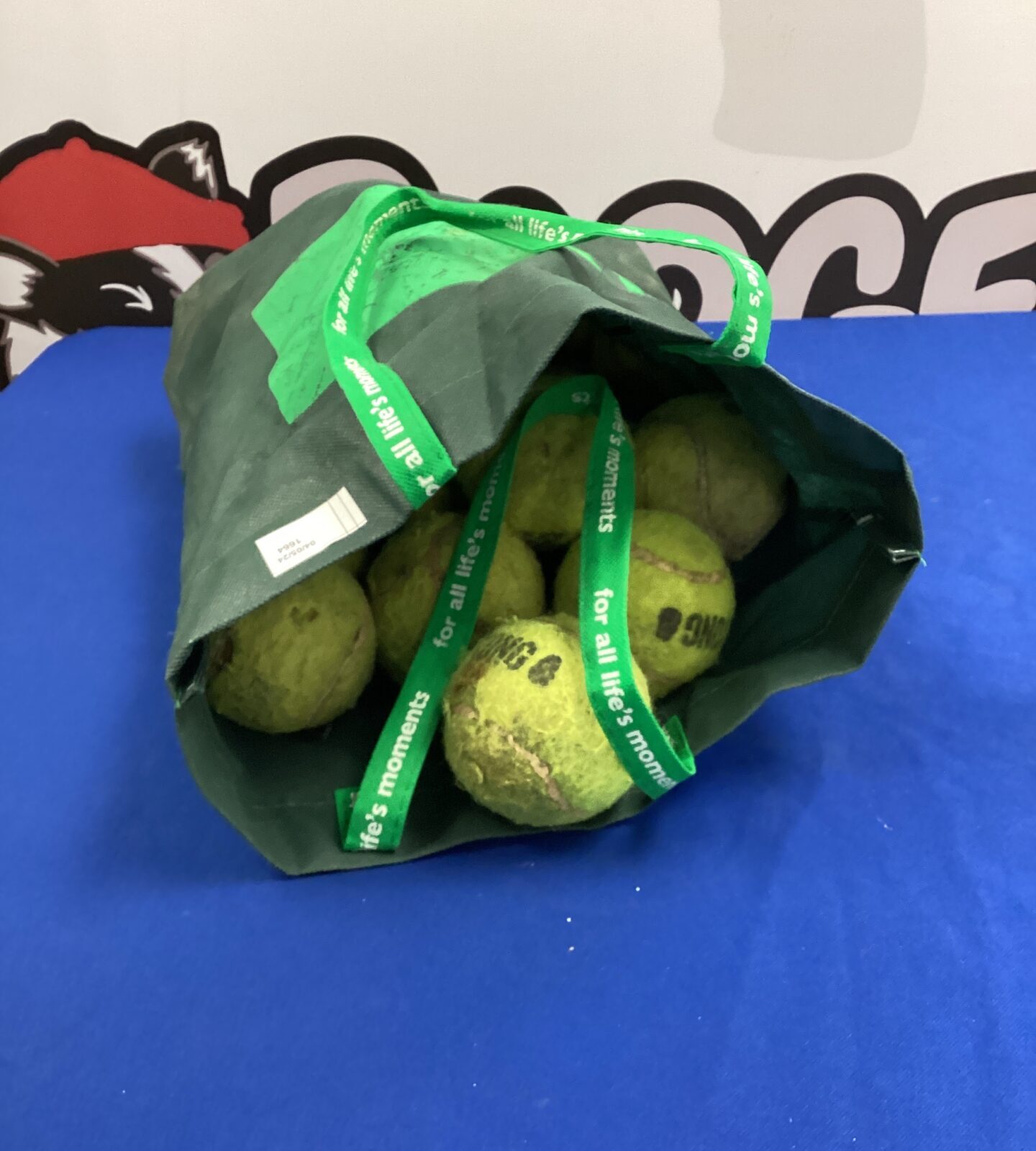 Bag of mixed sized tennis balls
