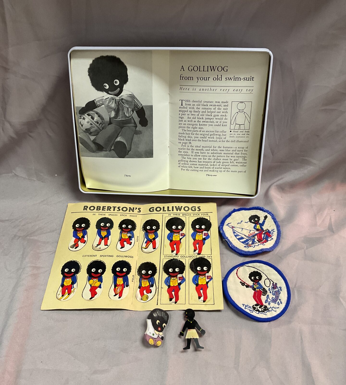 Collection of vintage robertson’s golly badges stickers and book