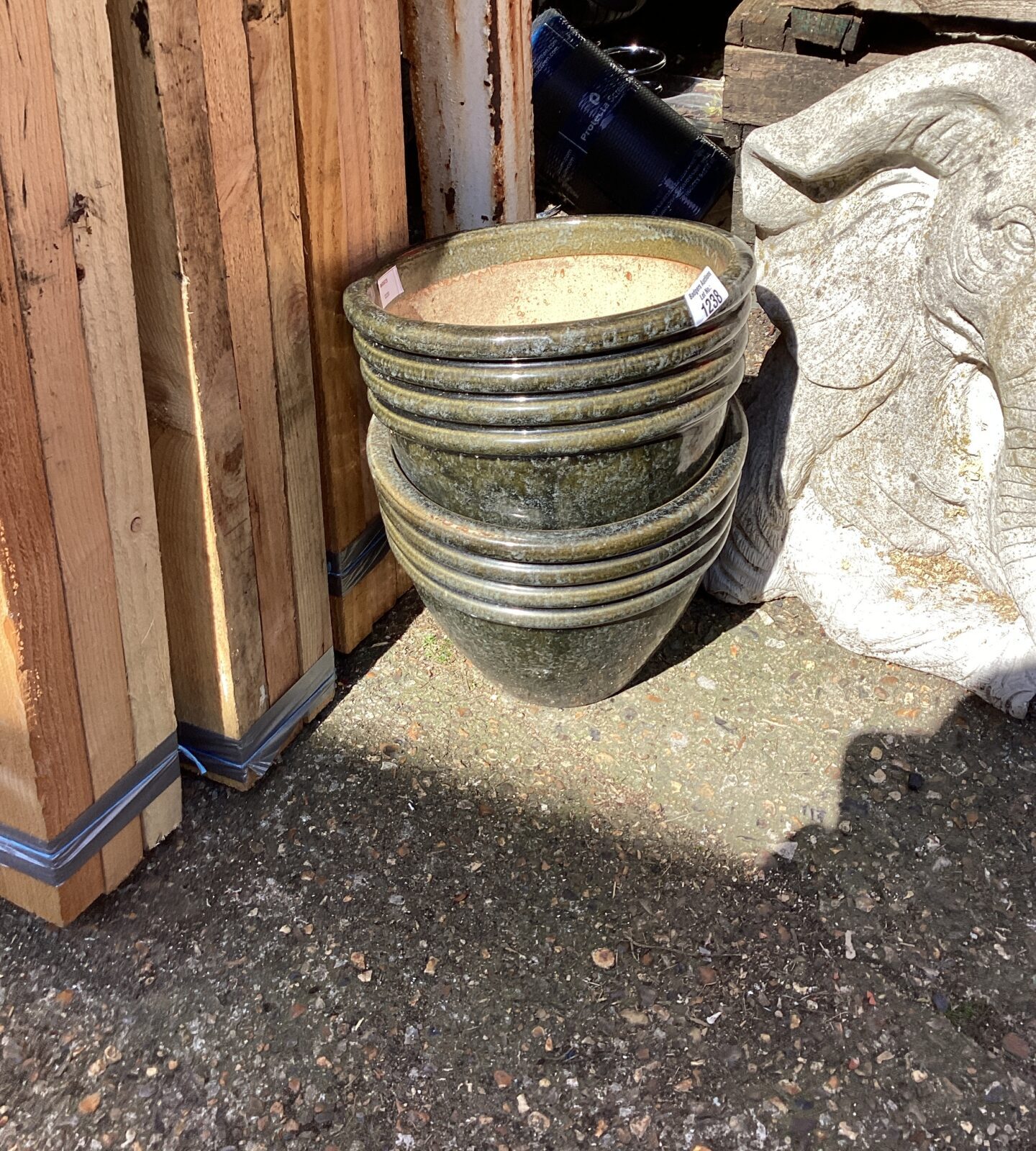 Seven glazed garden pots