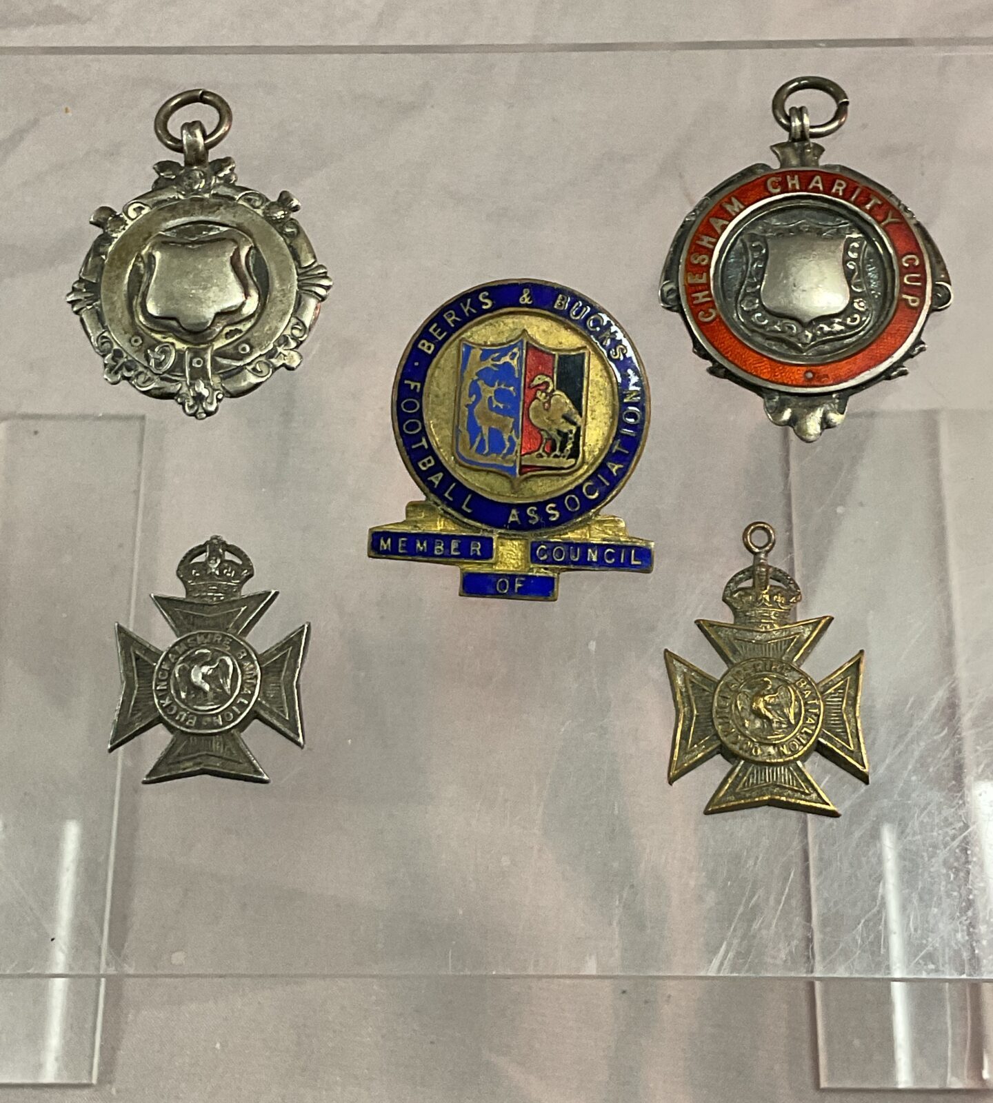 Five football related badges Inc two silver fobs