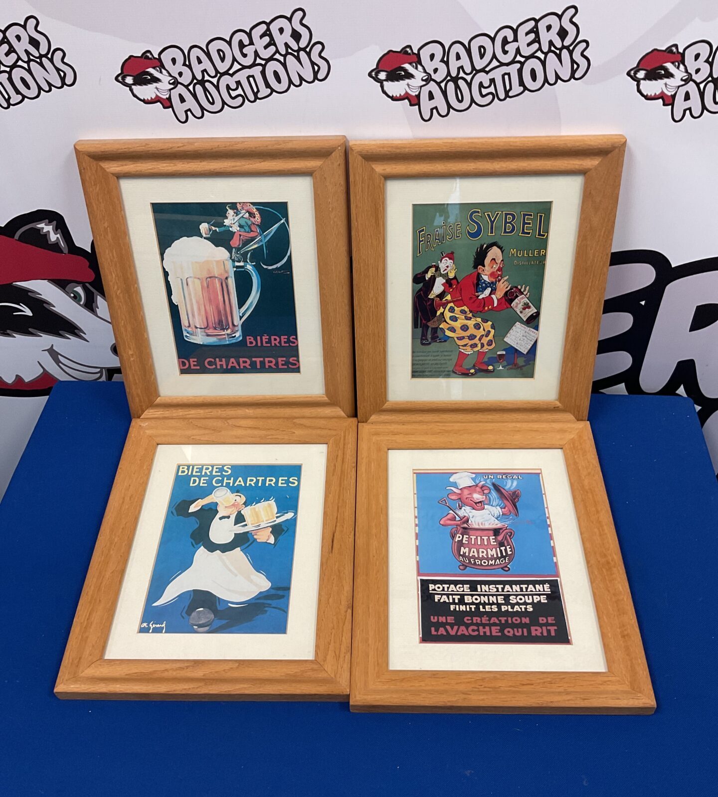 Set of four framed french advertising prints