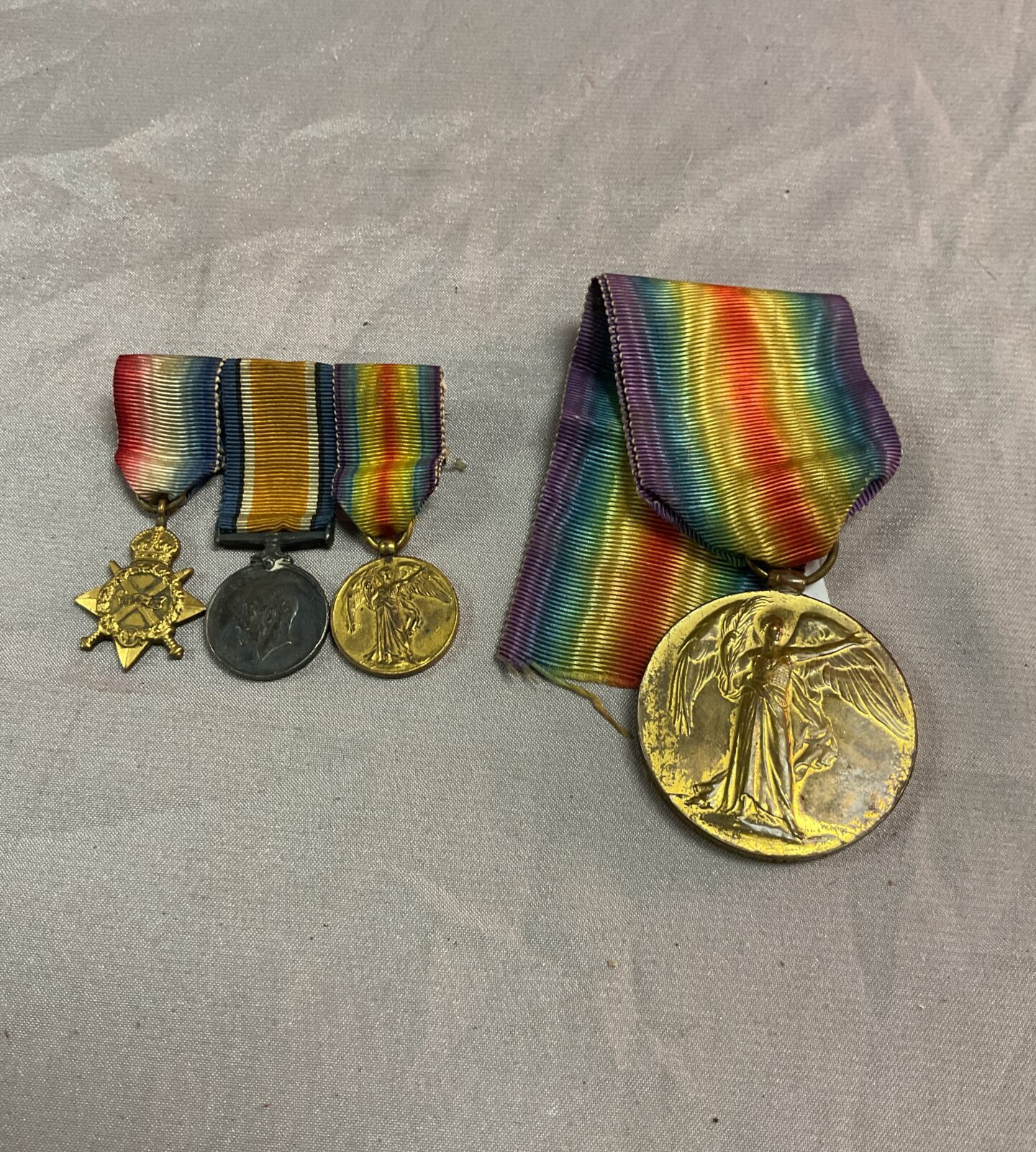 Full size ww1 victory medal and set of three miniature medals