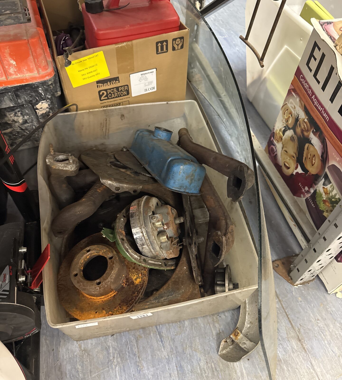 Box of classic mini parts with a windscreen & bumper