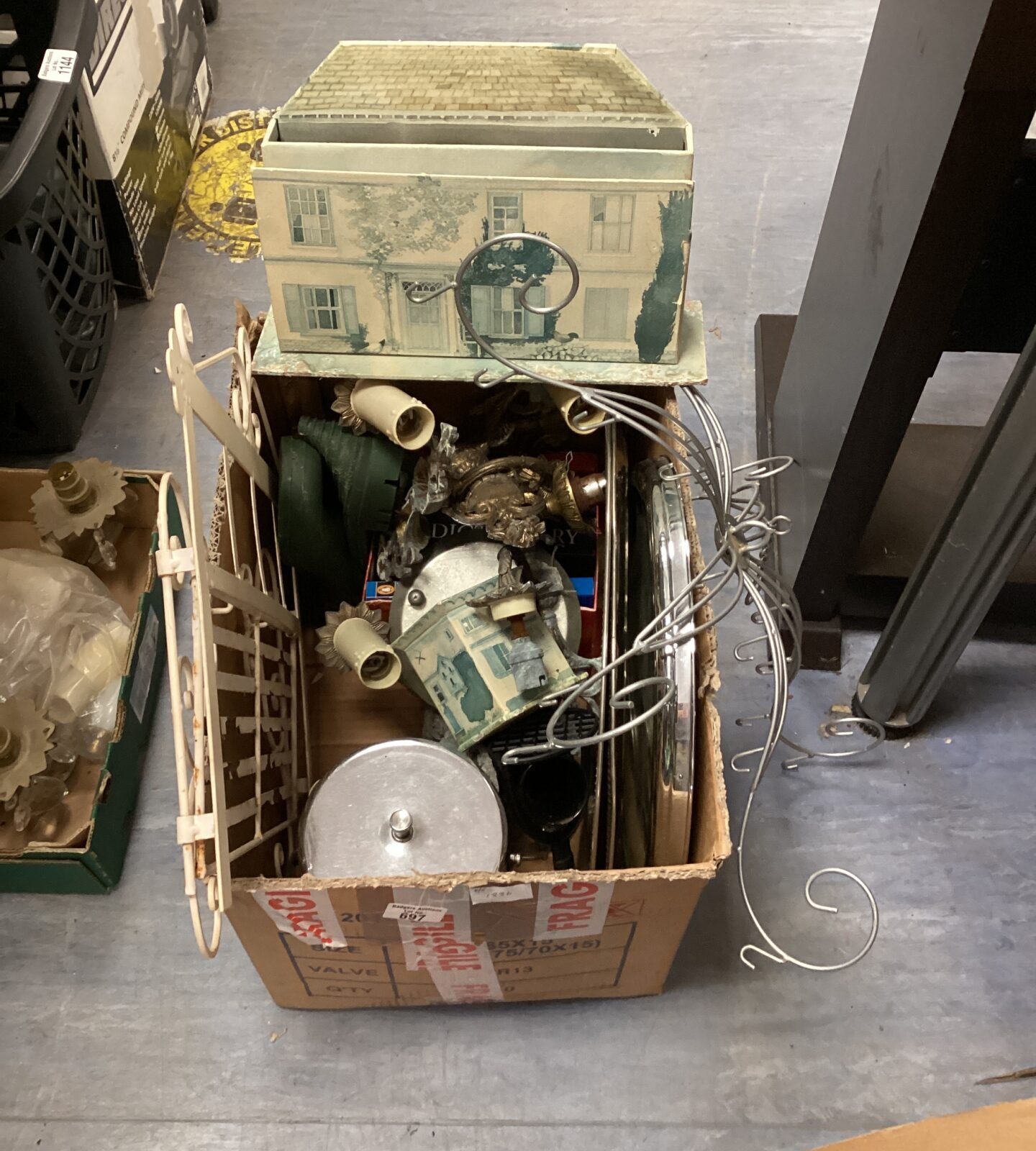box of odds inc mirror, letter rack and books