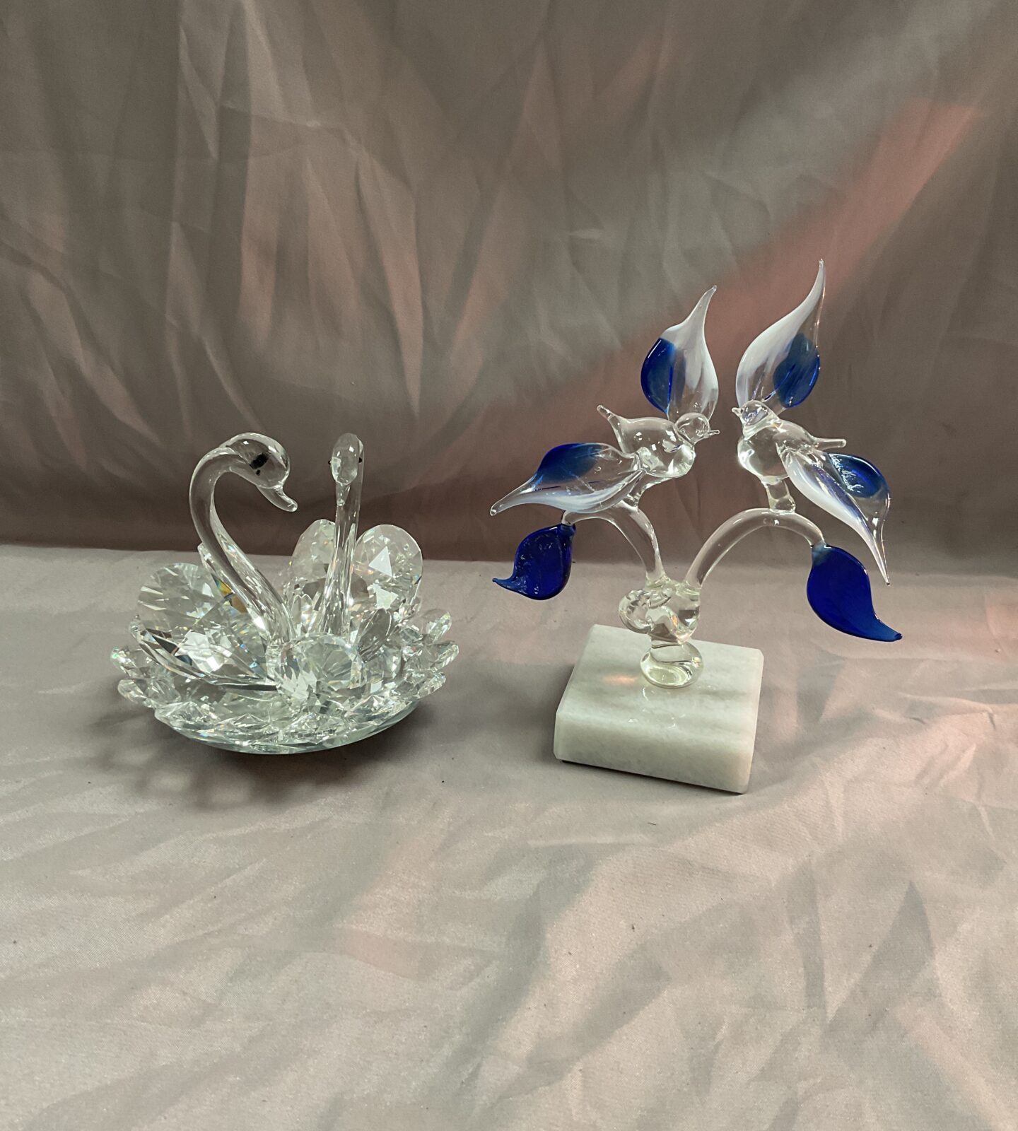 Rotating glass swan ornament and glass birds in tree