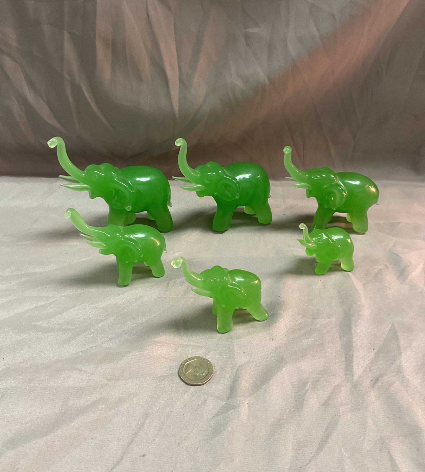 Set of six graduated jadite elephants
