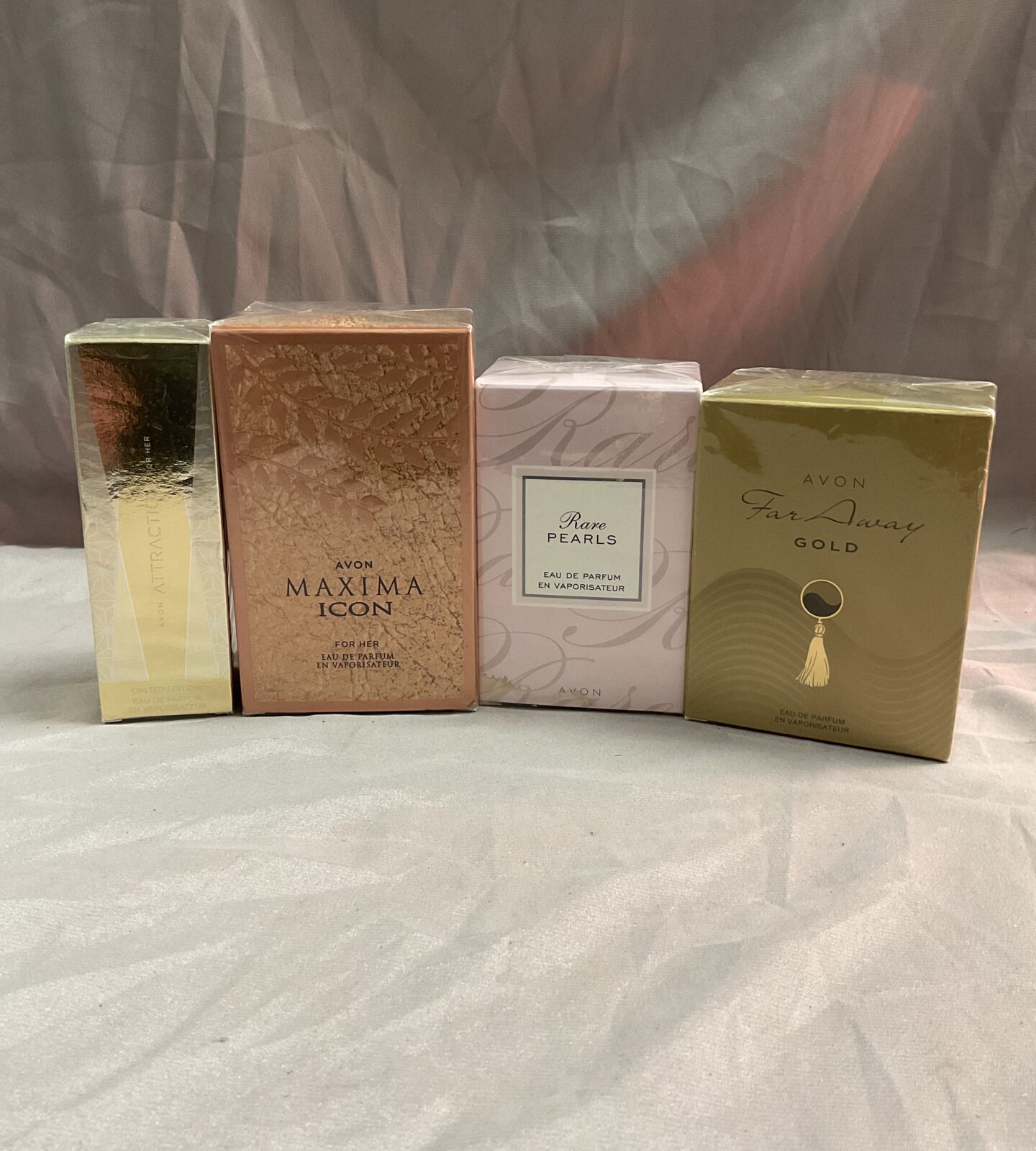 Four sealed Avon eau de parfum