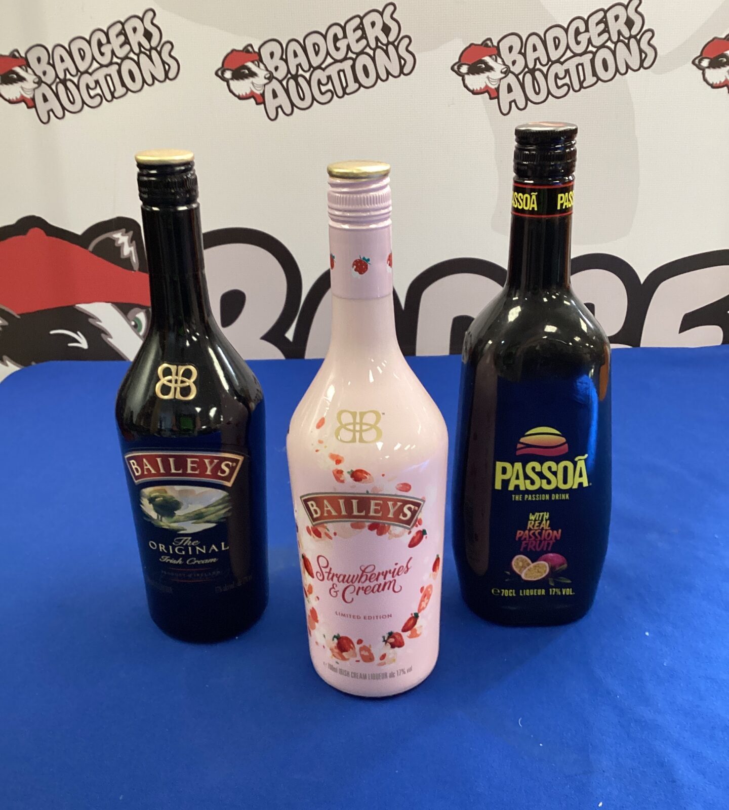 Three bottles of alcohol spirits inc baileys strawberries & cream, baileys original & passoa