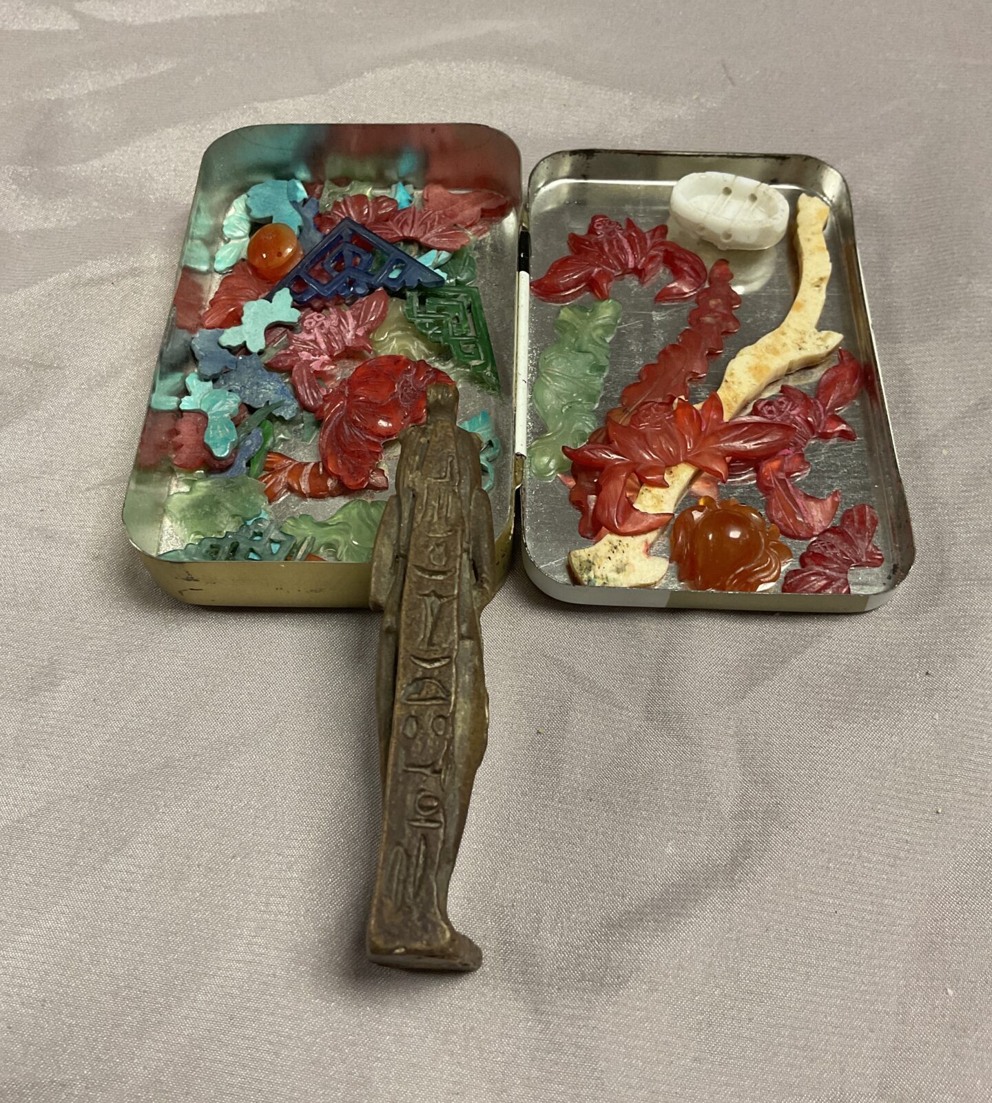 Tin of jadeite decorative items and Egyptian God Amulet? - Image 2