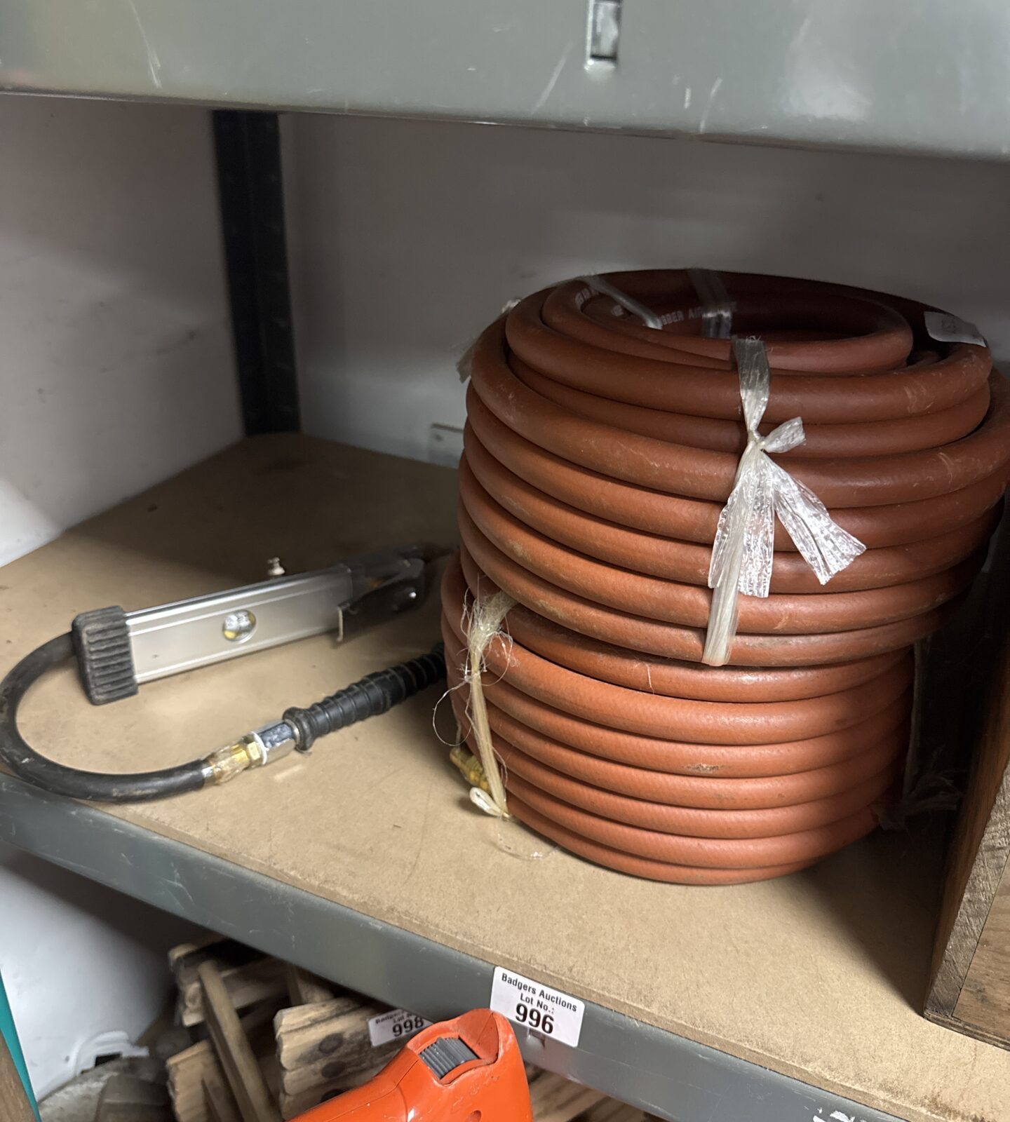 Two rolls of air hose with a tyre inflator