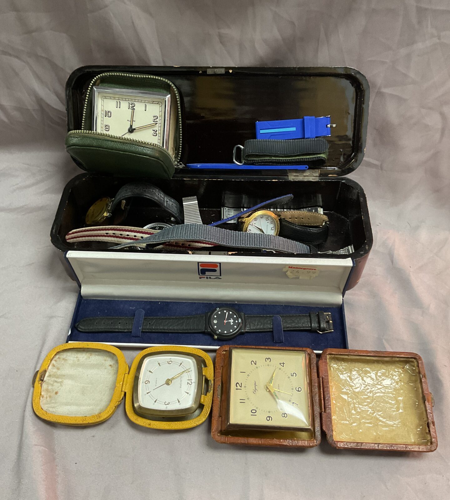 Box of assorted watches travel clocks and new watch straps