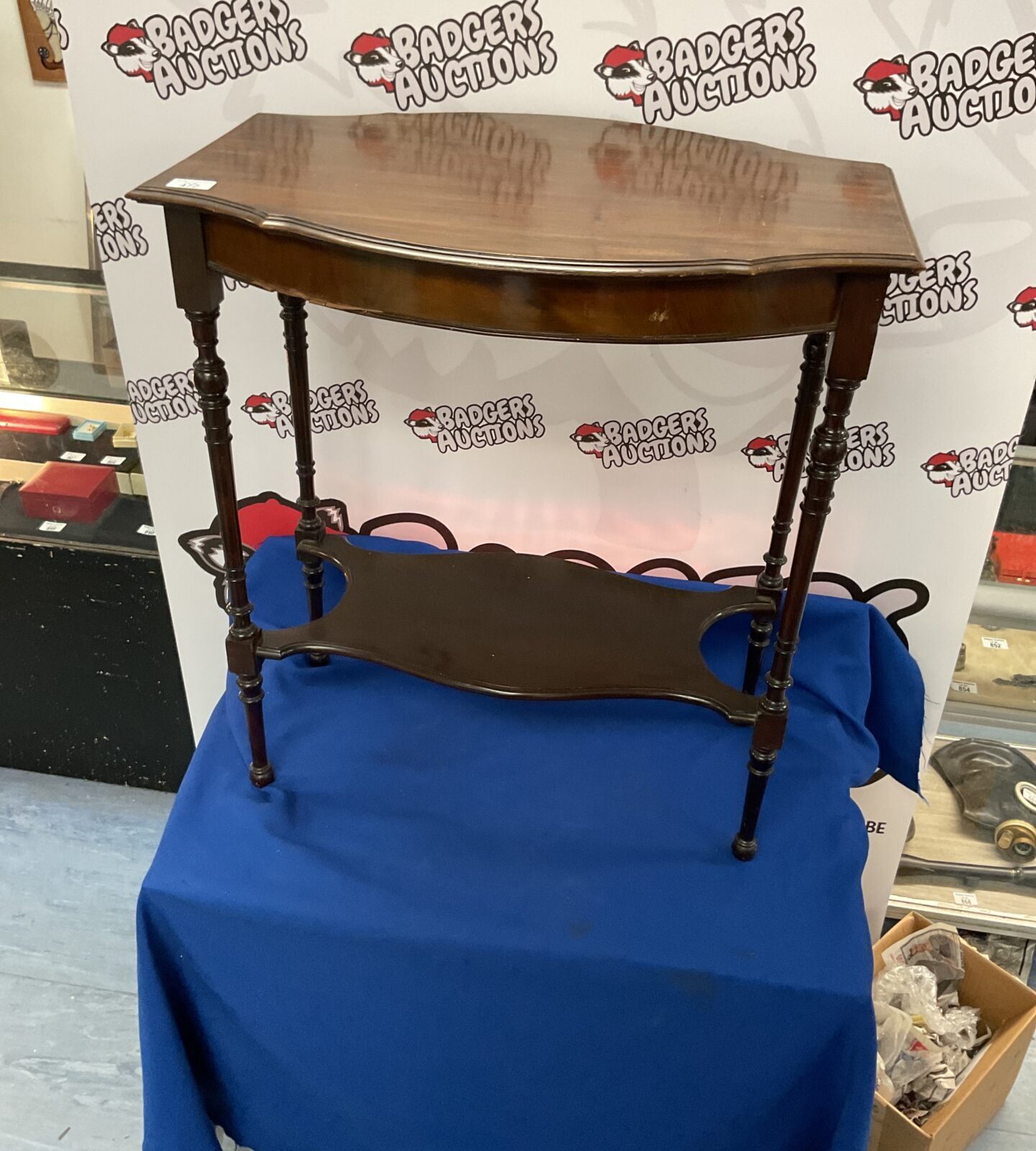 Repro mahogany side table with small break