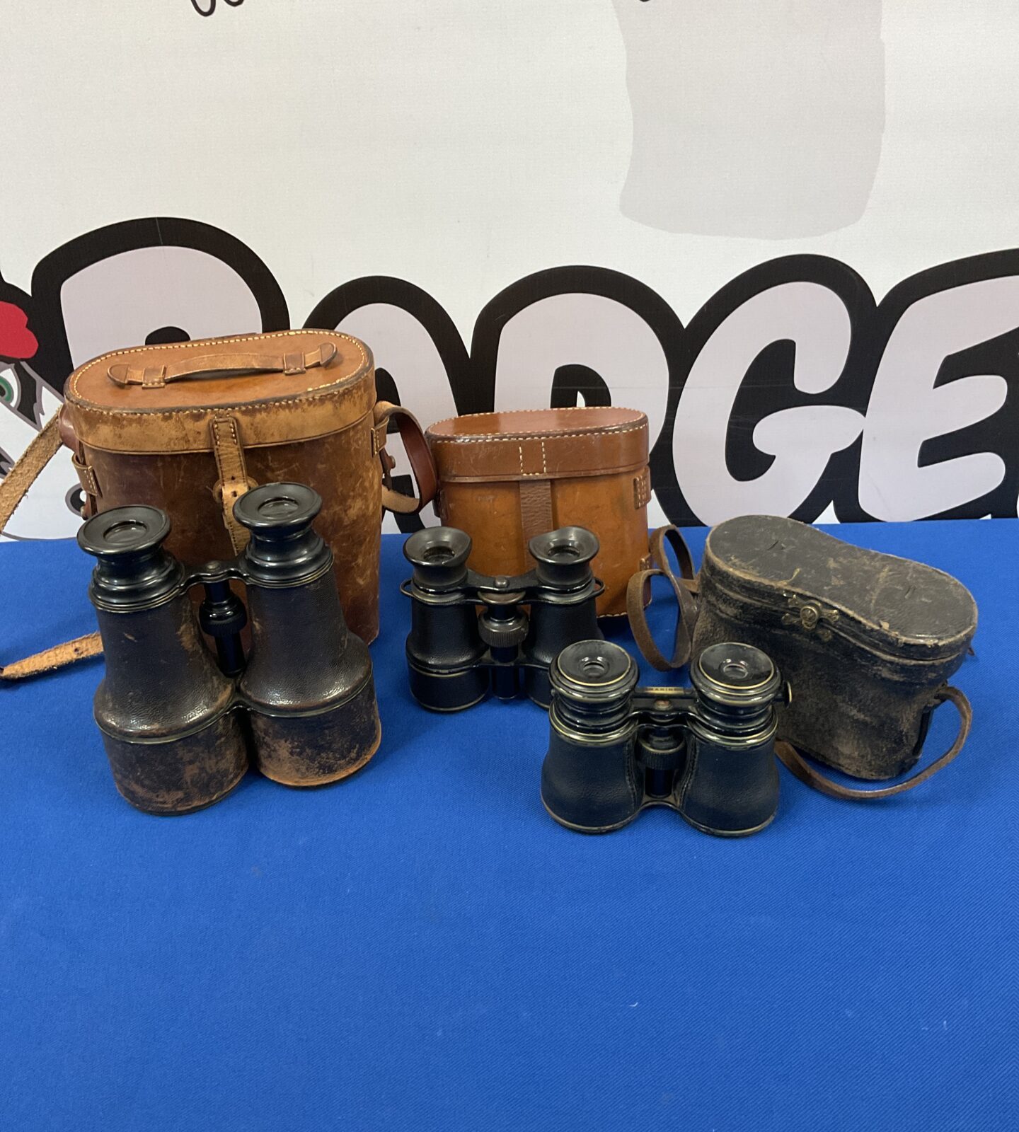 Three vintage pairs of binoculars including marine