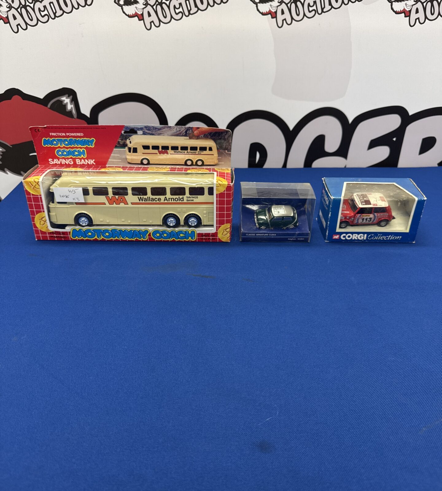 Three die cast models inc corgi mini & coach money saving bank