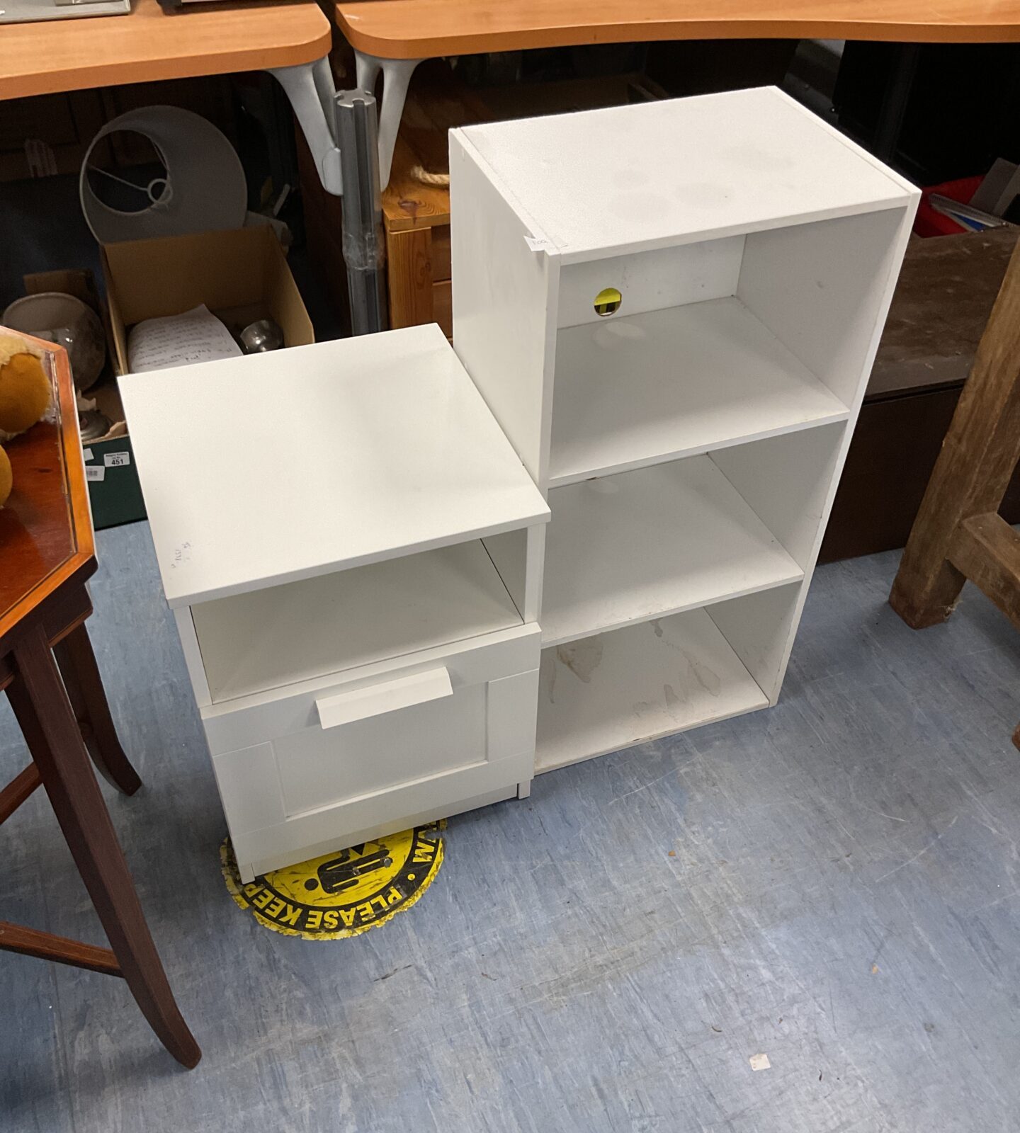 White bedside table with white shelfing unit