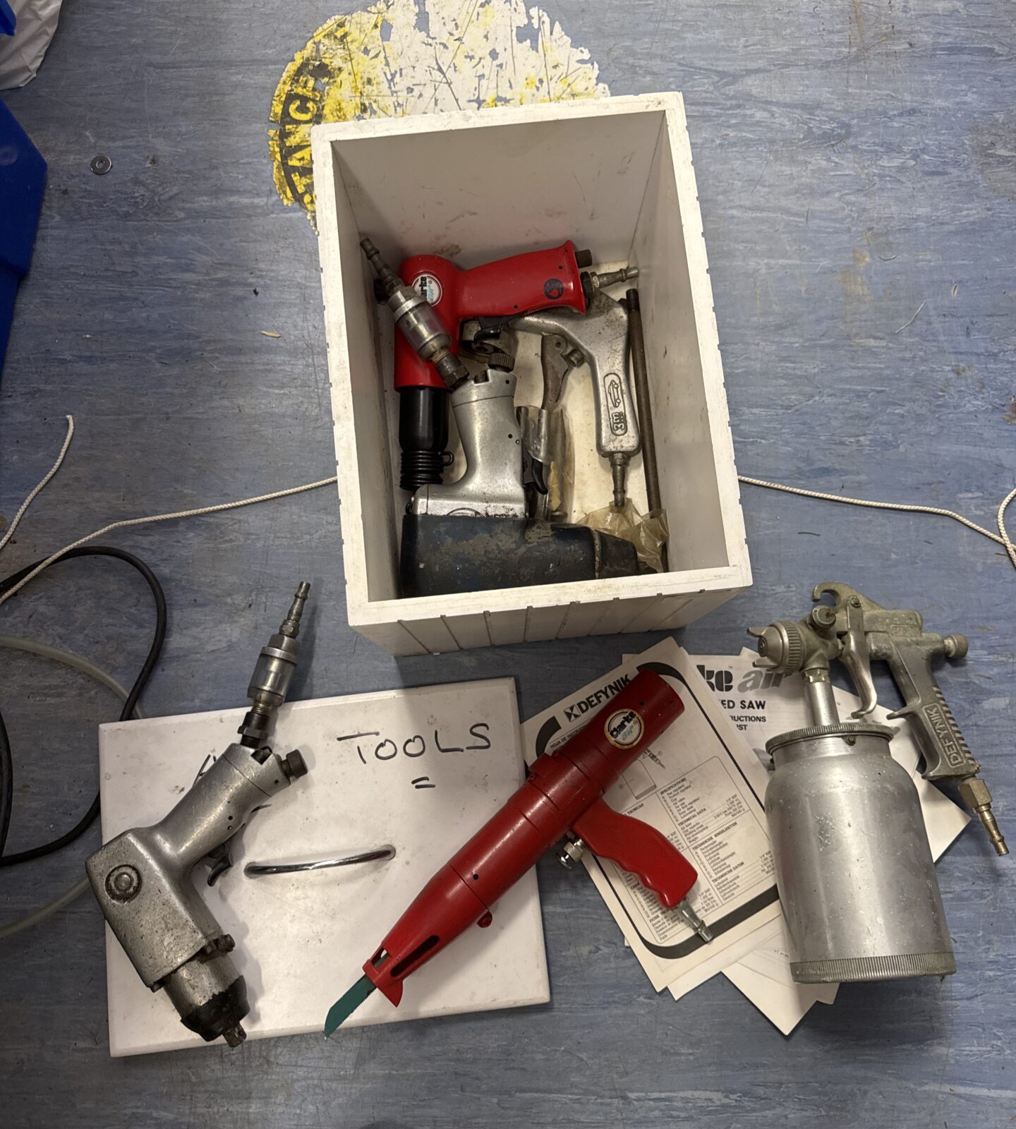 Box of assorted air tools inc spray gun, air chisel, impact gun & others with some manuals - Image 2