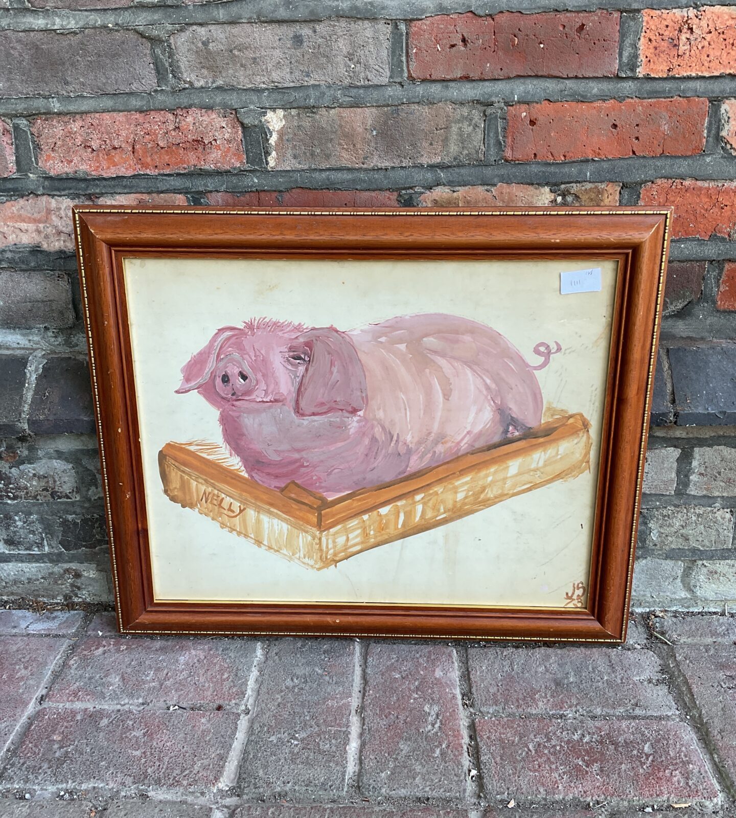 Framed folk art watercolour of a pig named nelly