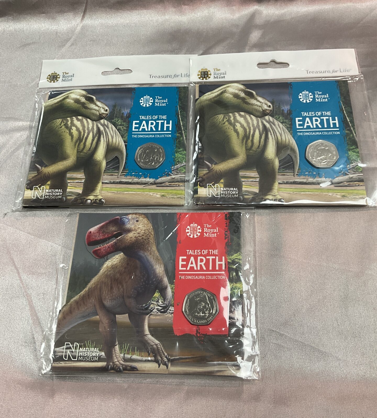 Three Royal mint tales of the earth dinosauria collection