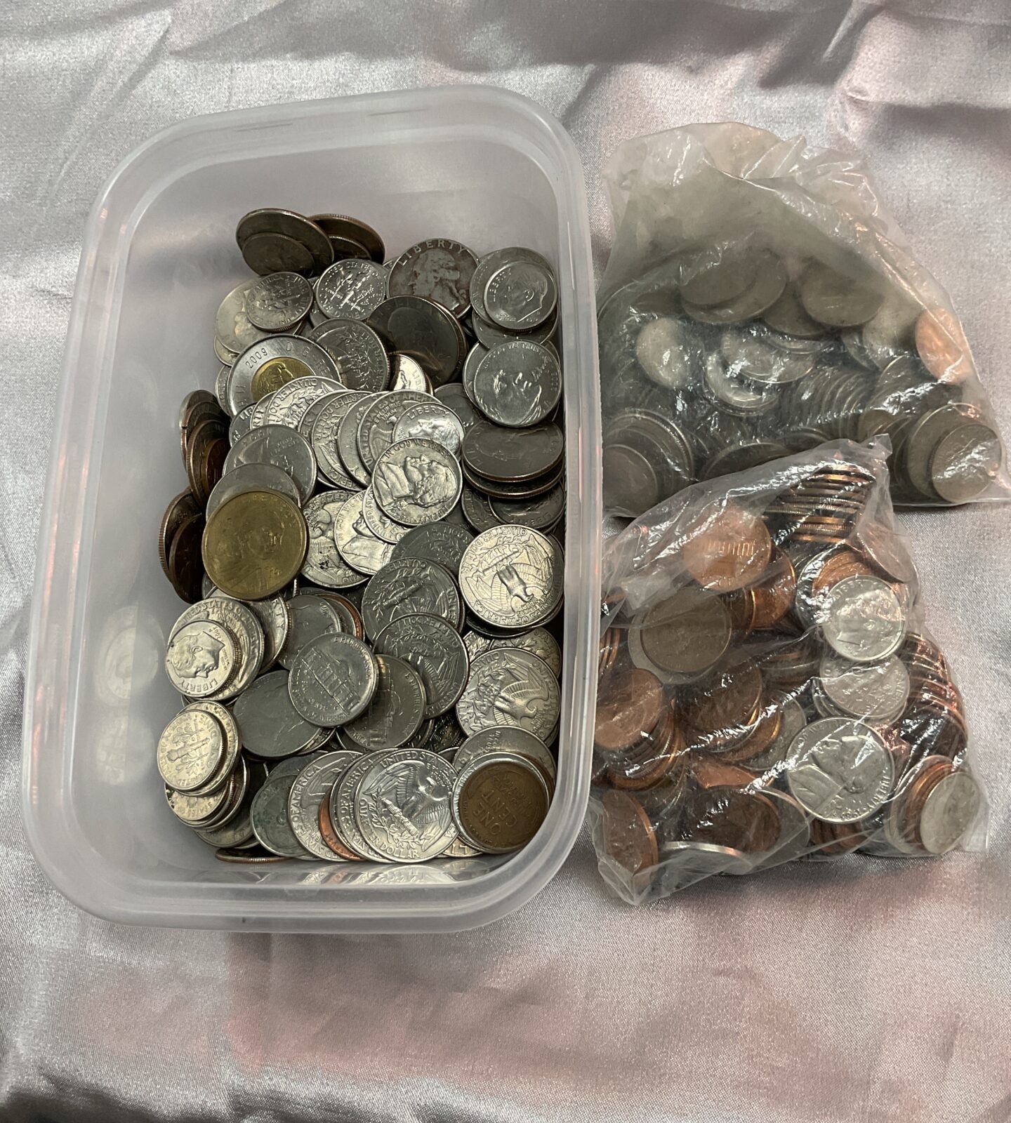 Tub and two bags of American coins