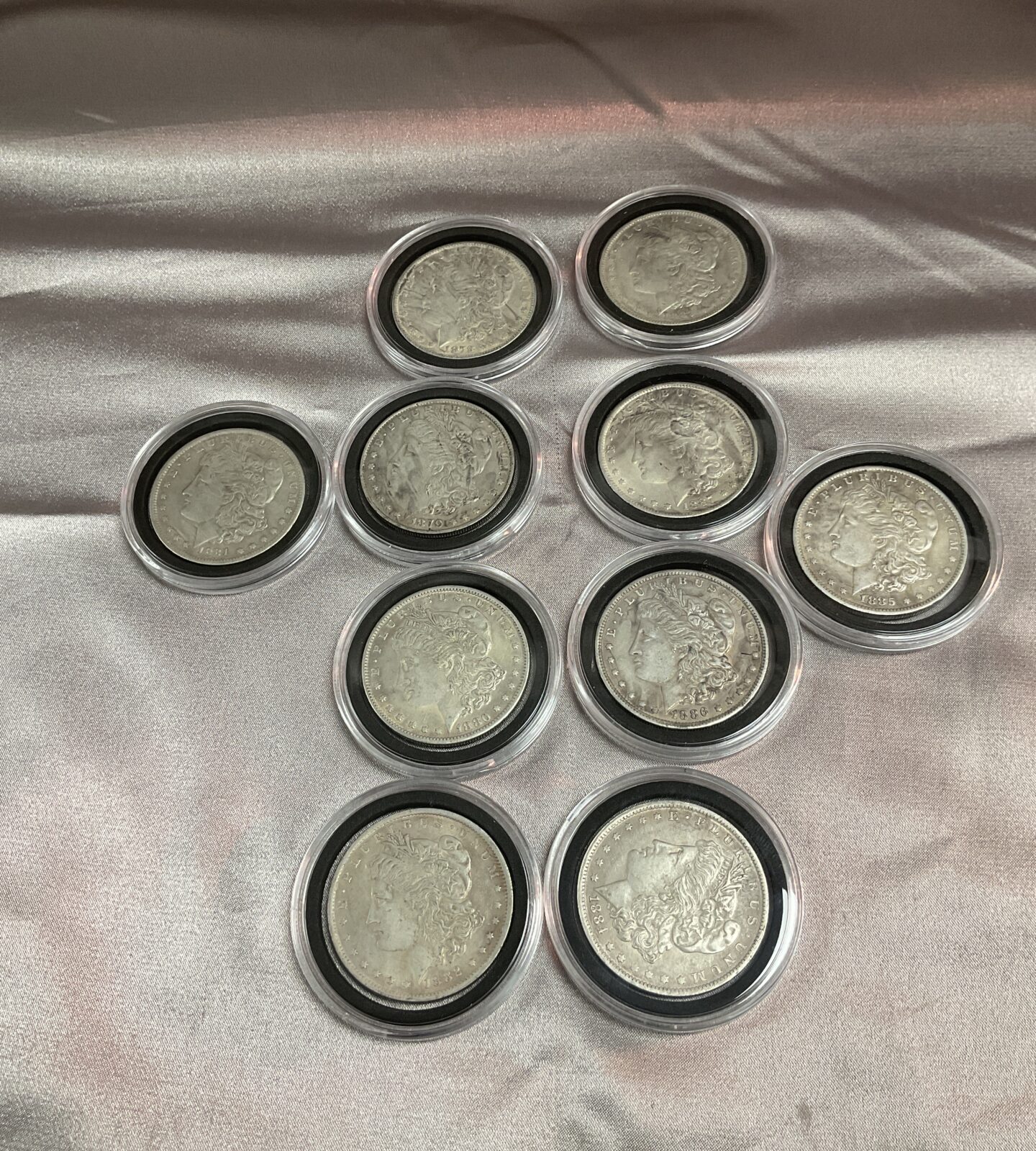 Ten replica Morgan Dollar coins 1878-1887