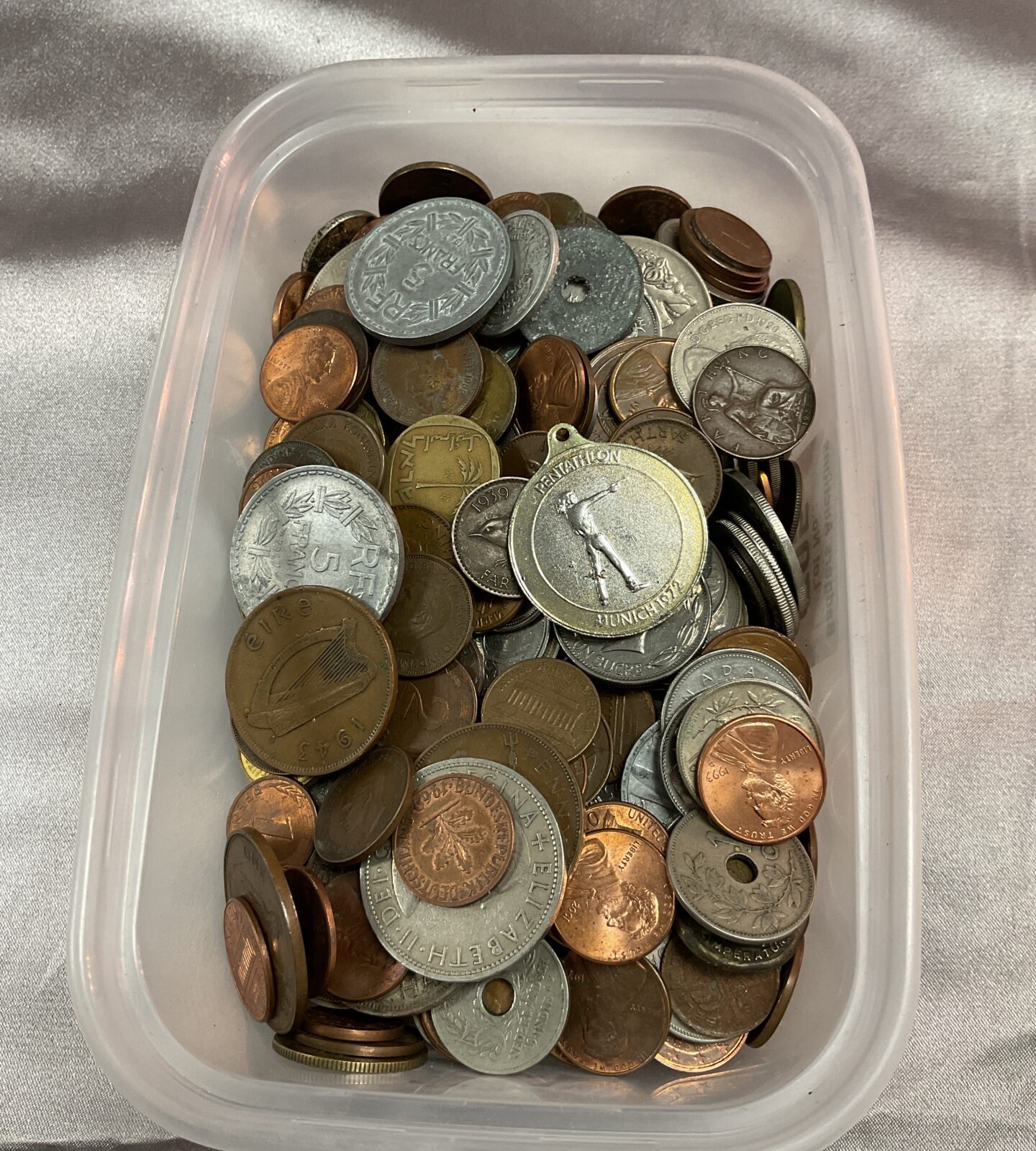 Tub of assorted coins