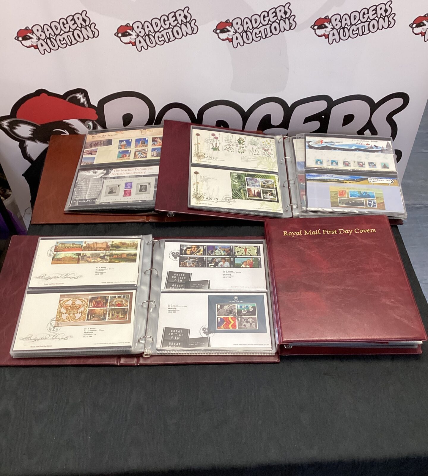 Four royal mail first day covers folders three with contents