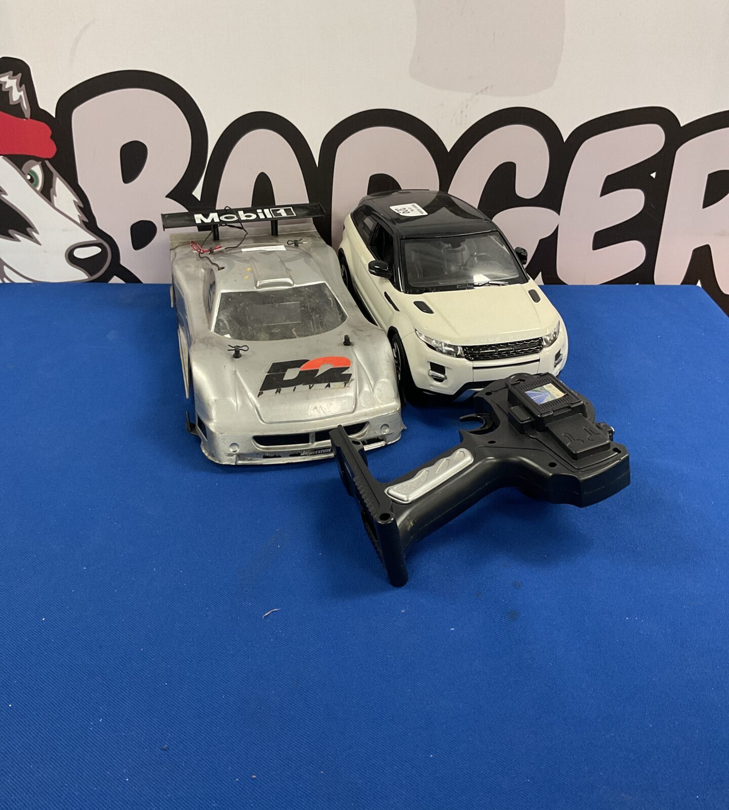 Two rc cars inc nikko and Range Rover