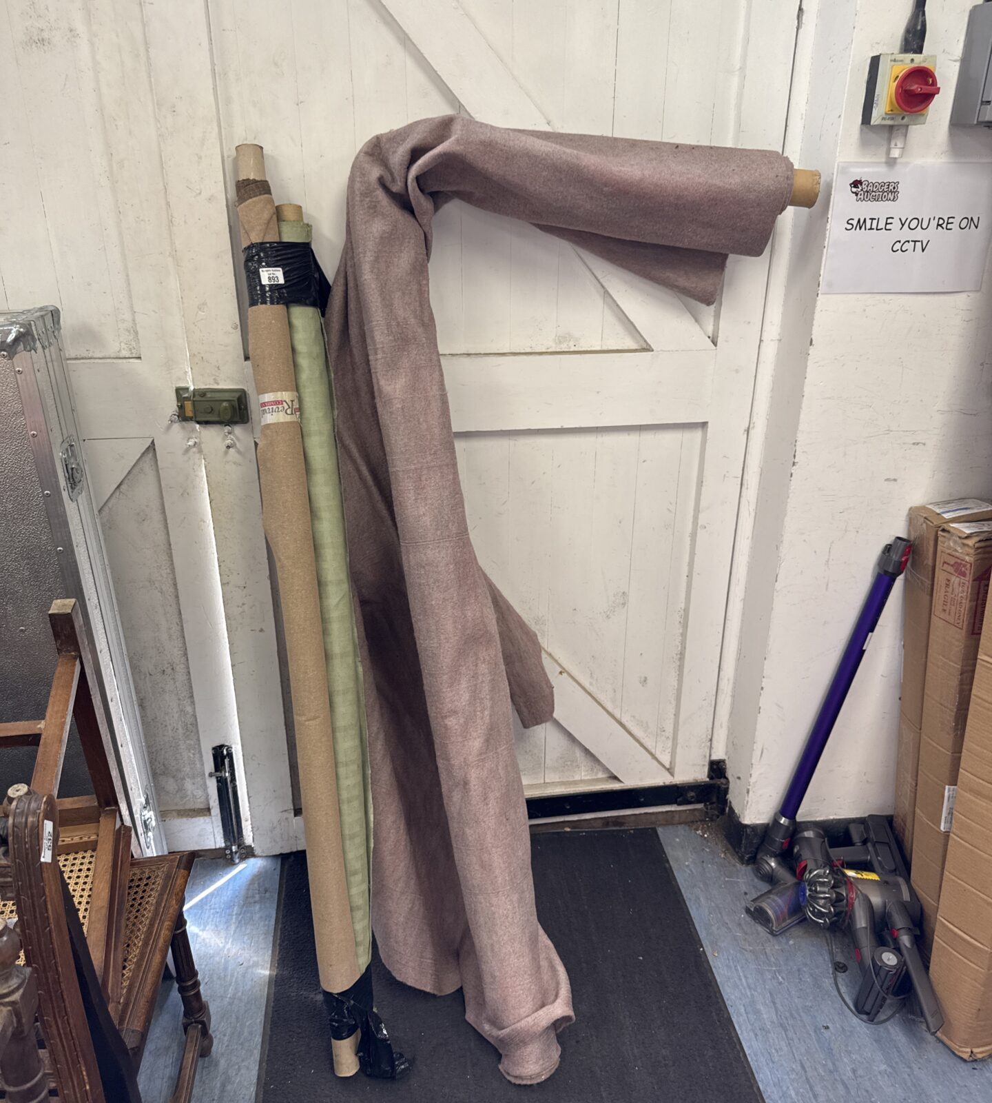 Three part used rolls of fabric