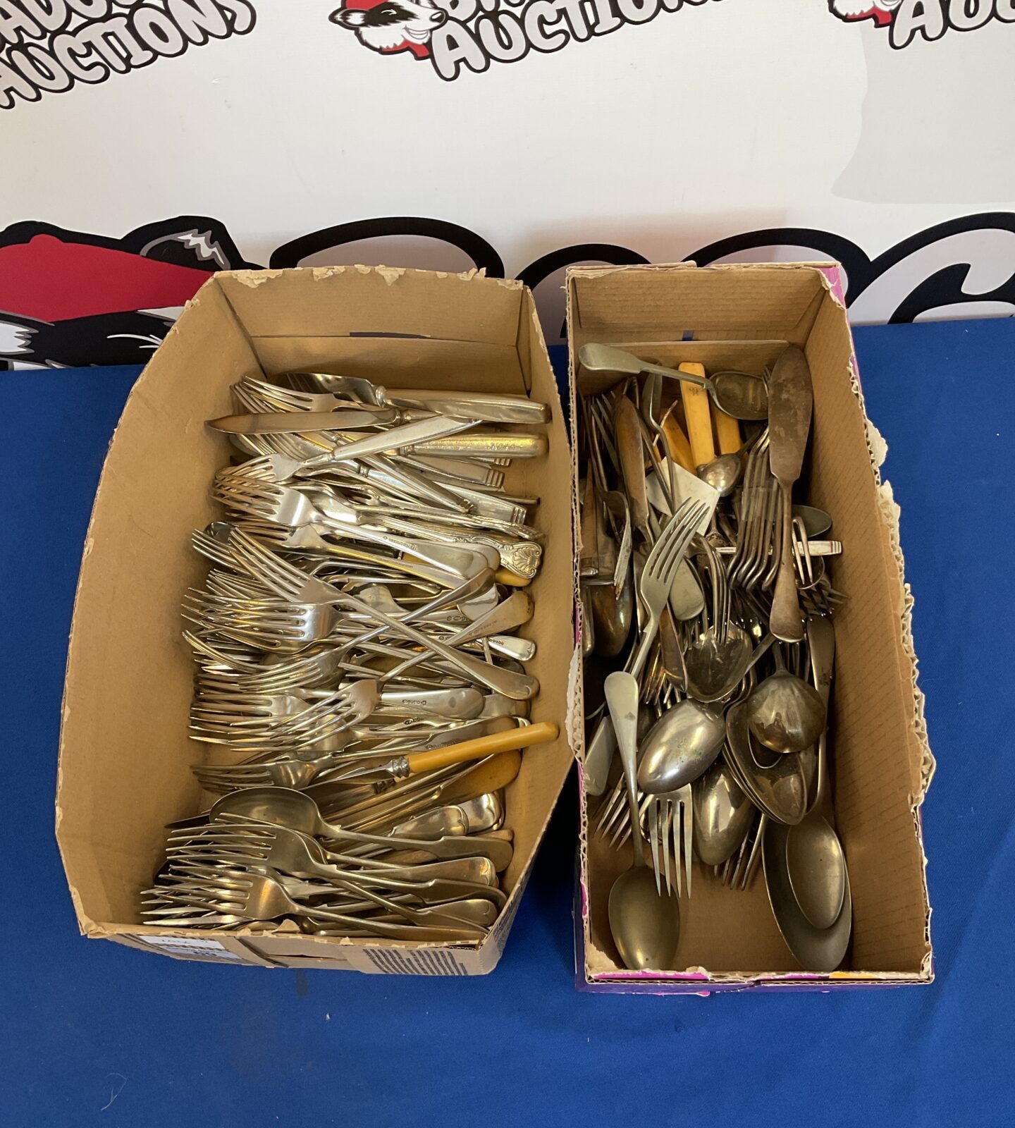 Two boxes of silver plate cutlery