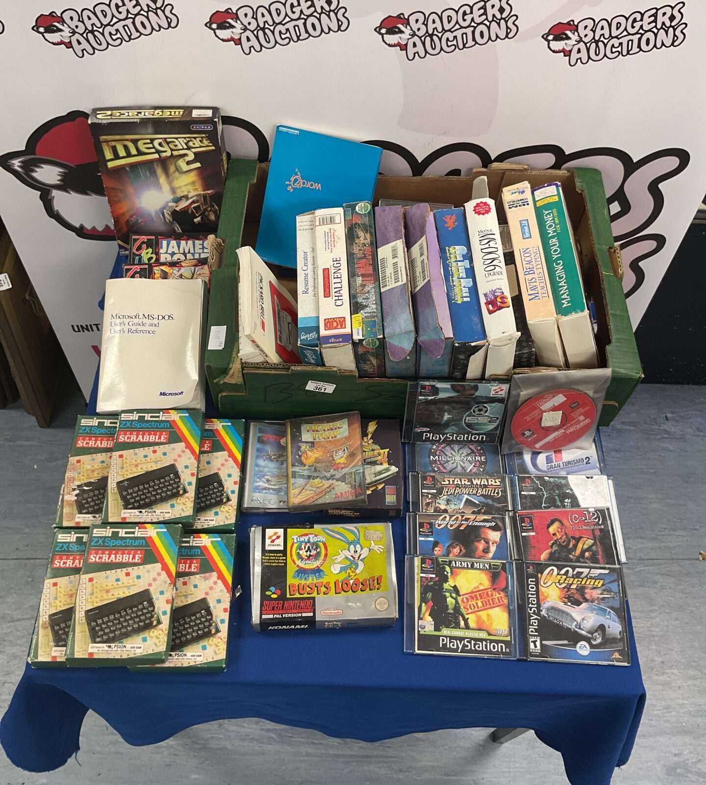 Box of vintage computer softwares, manuals and games inc sinclair computer scrabble and ps1 demo discs