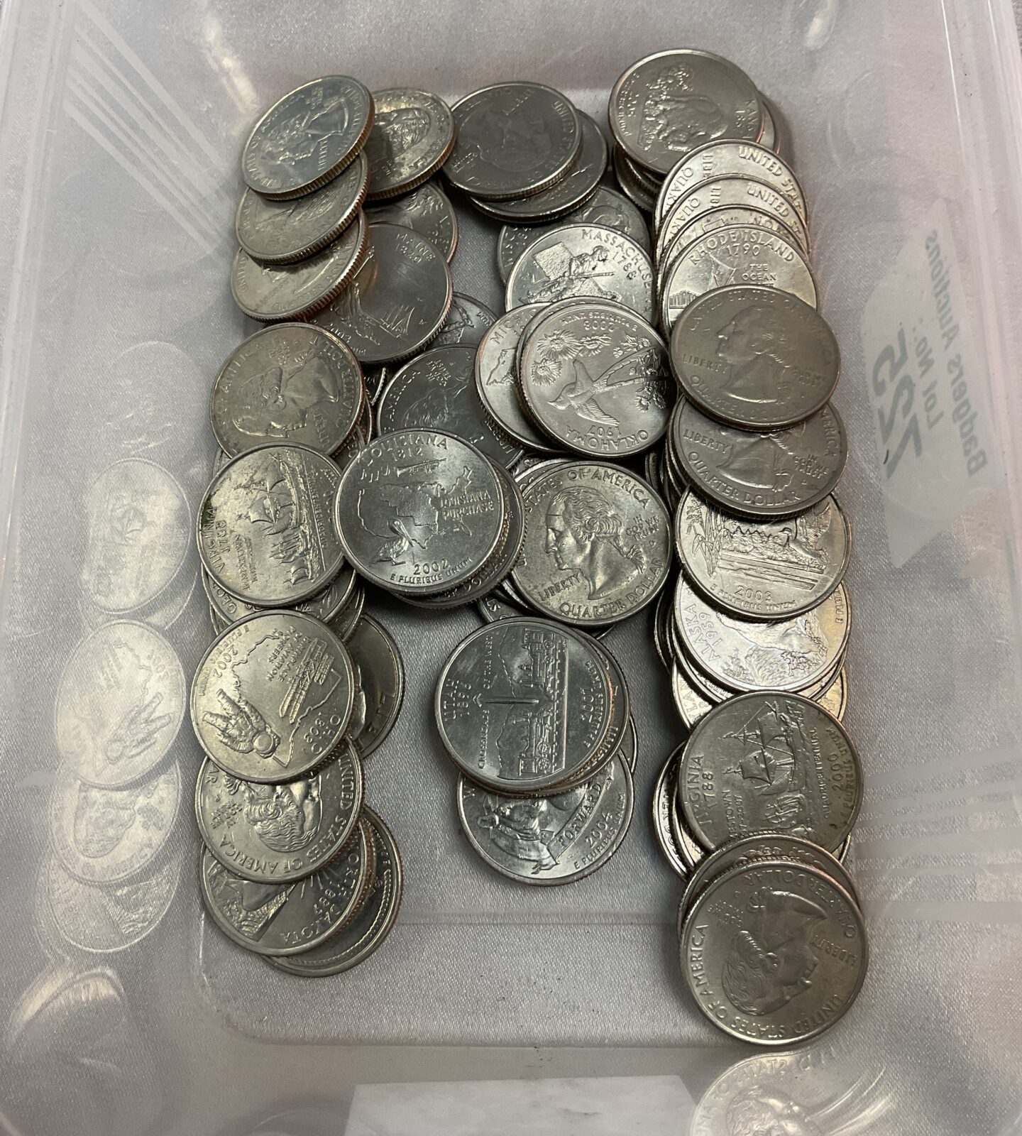 Tub of 67 American State Quarter dollars