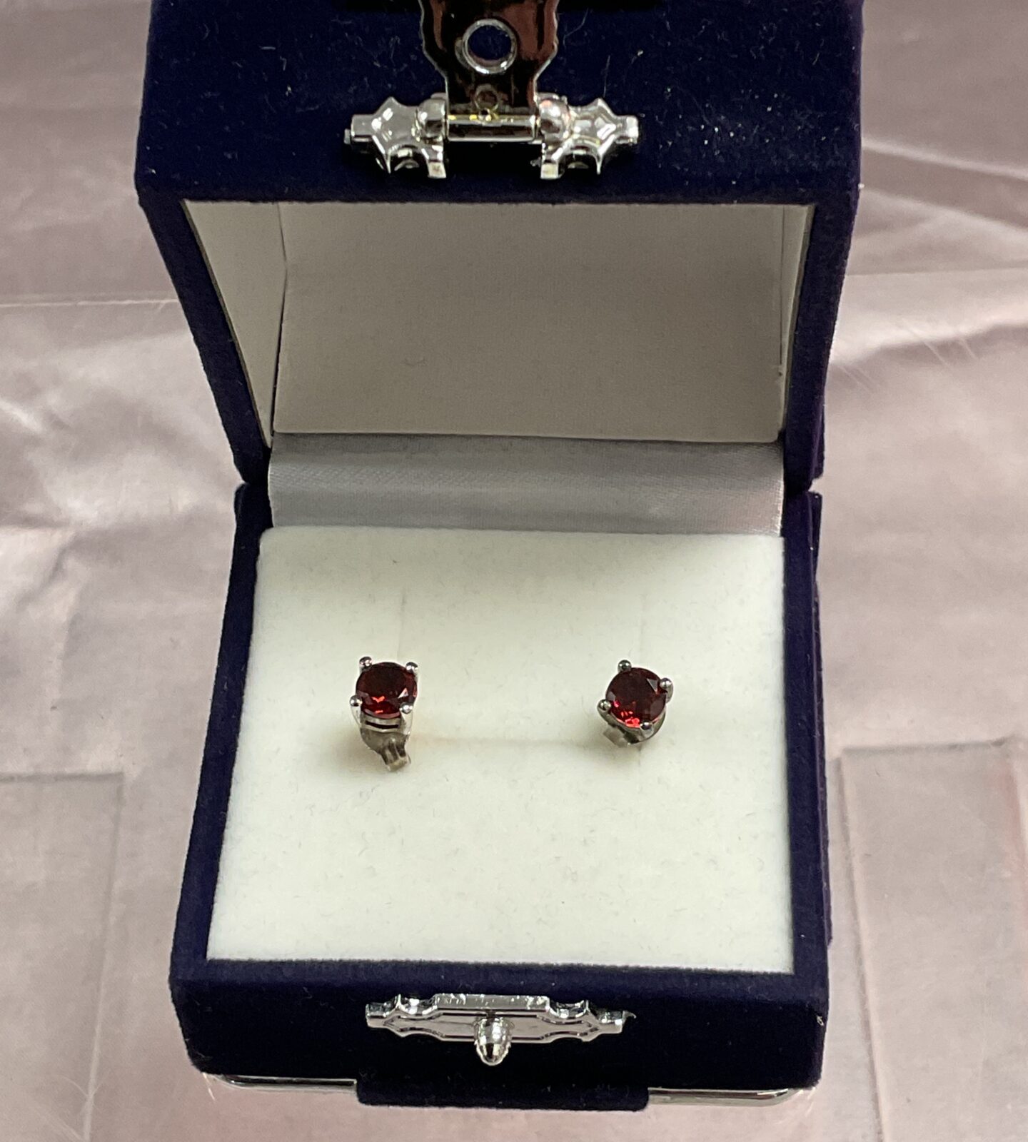 pair of sterling silver garnet stud earrings
