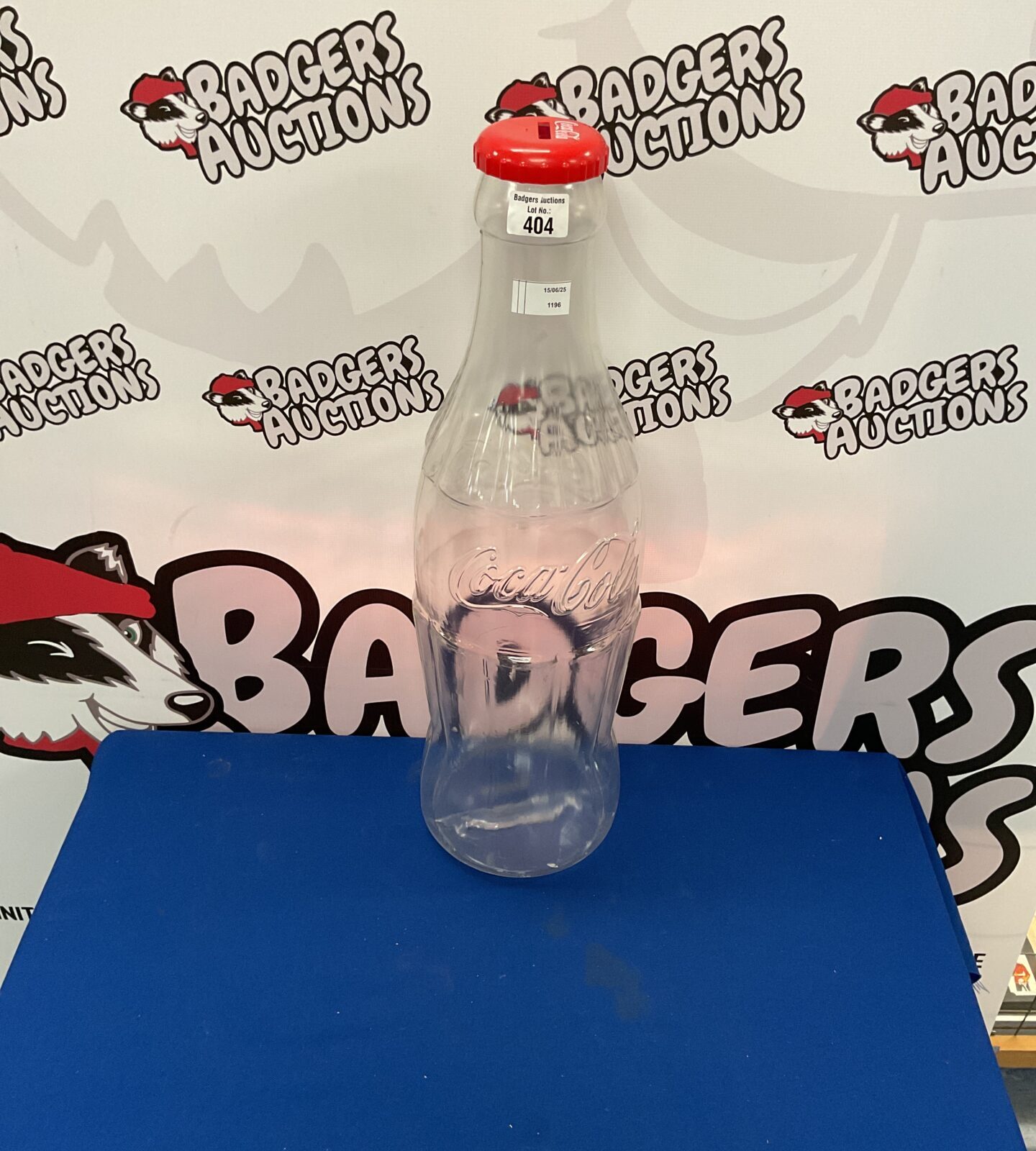 Large plastic coco cola money bottle