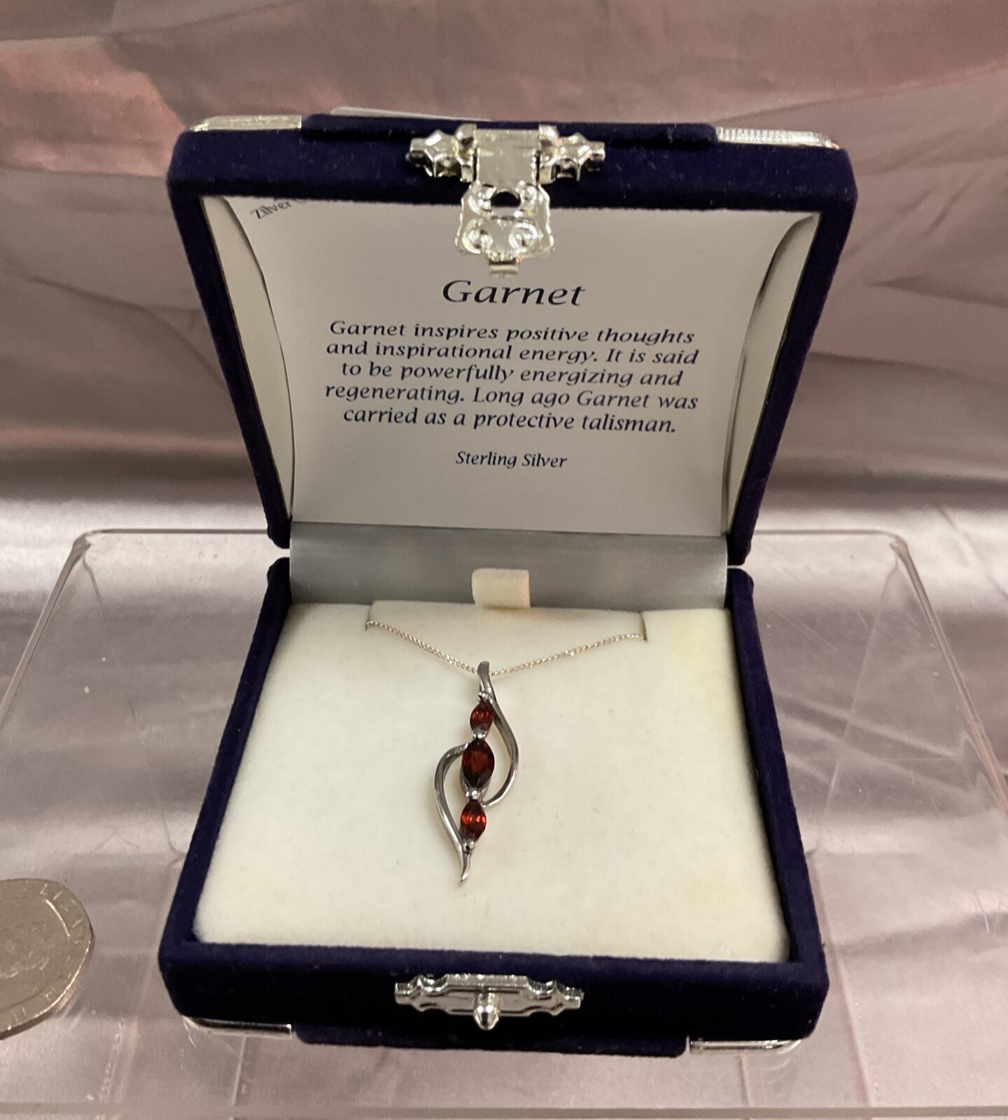 Garnet pendant necklace with three garnets mounted in sterling silver