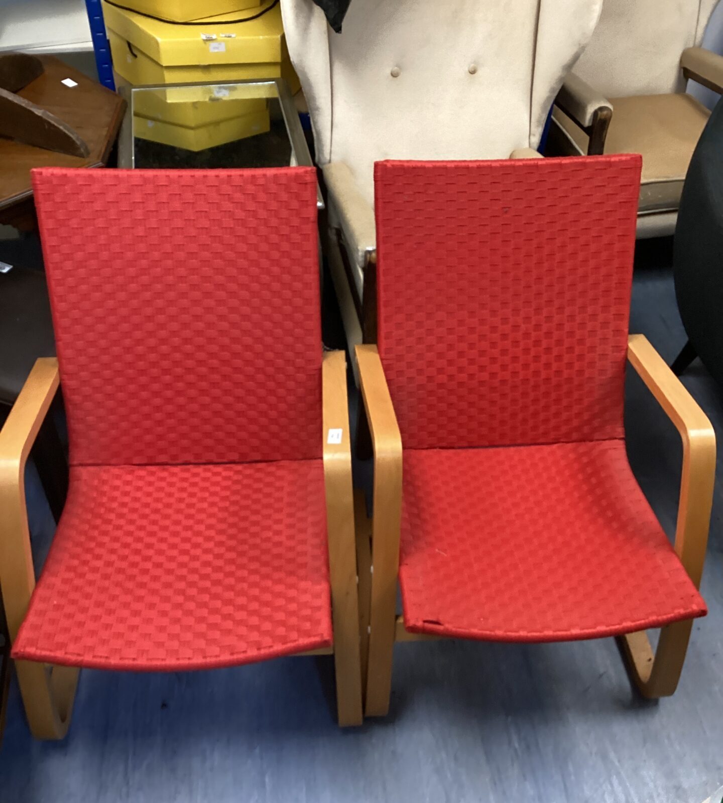 Two red living room chairs
