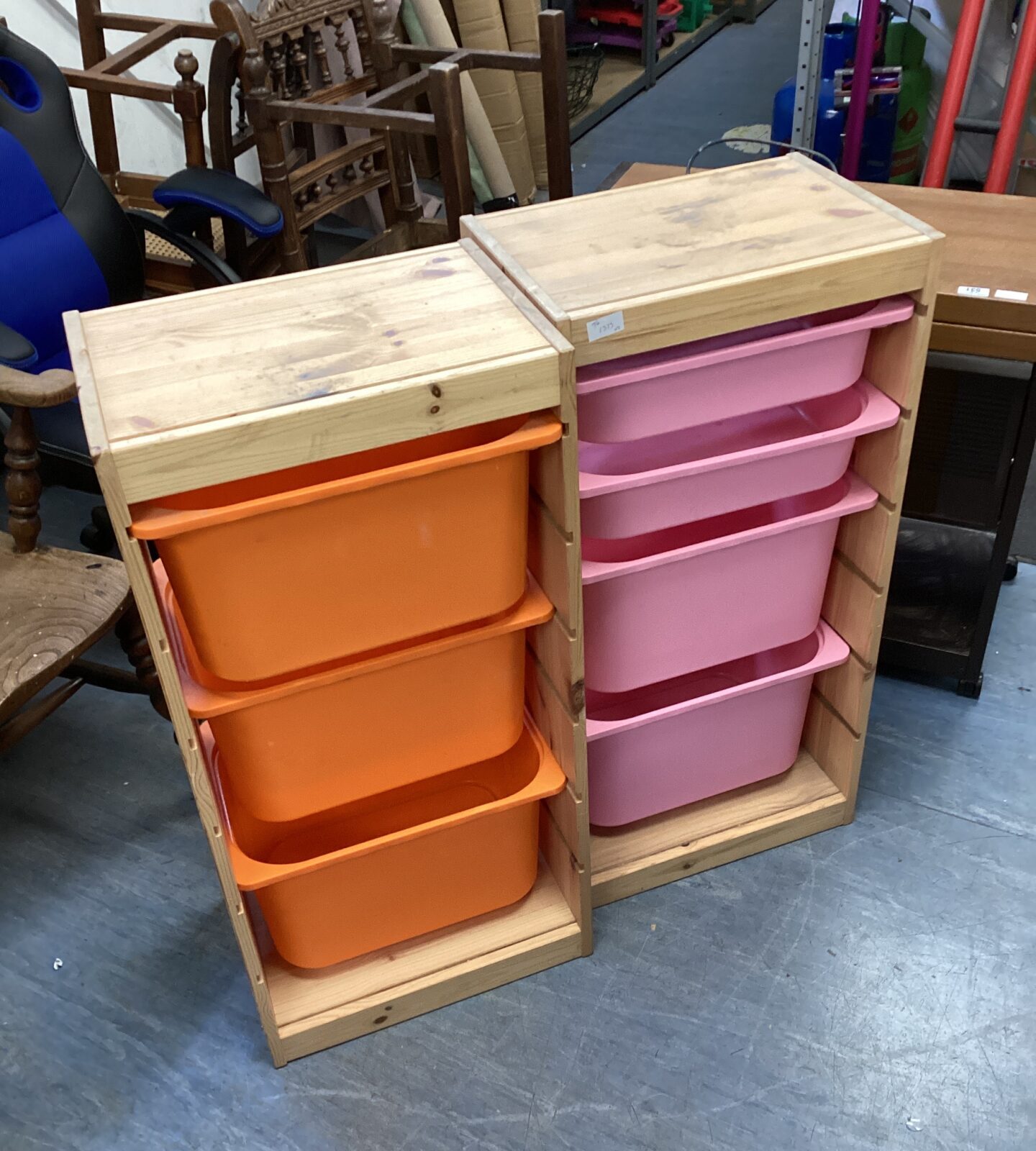 Two wooden storage units with plastic storage tubs