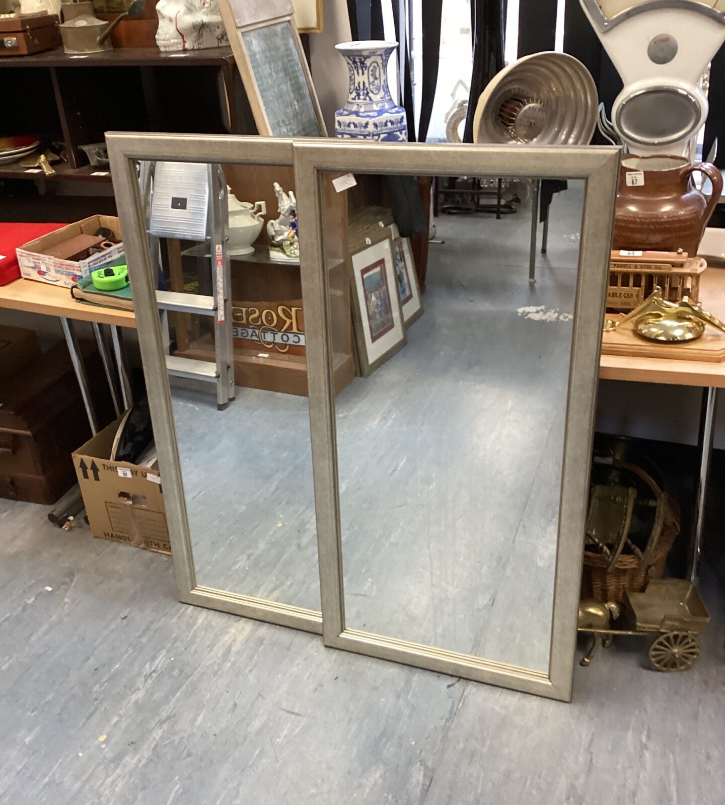 Two framed wall mirrors