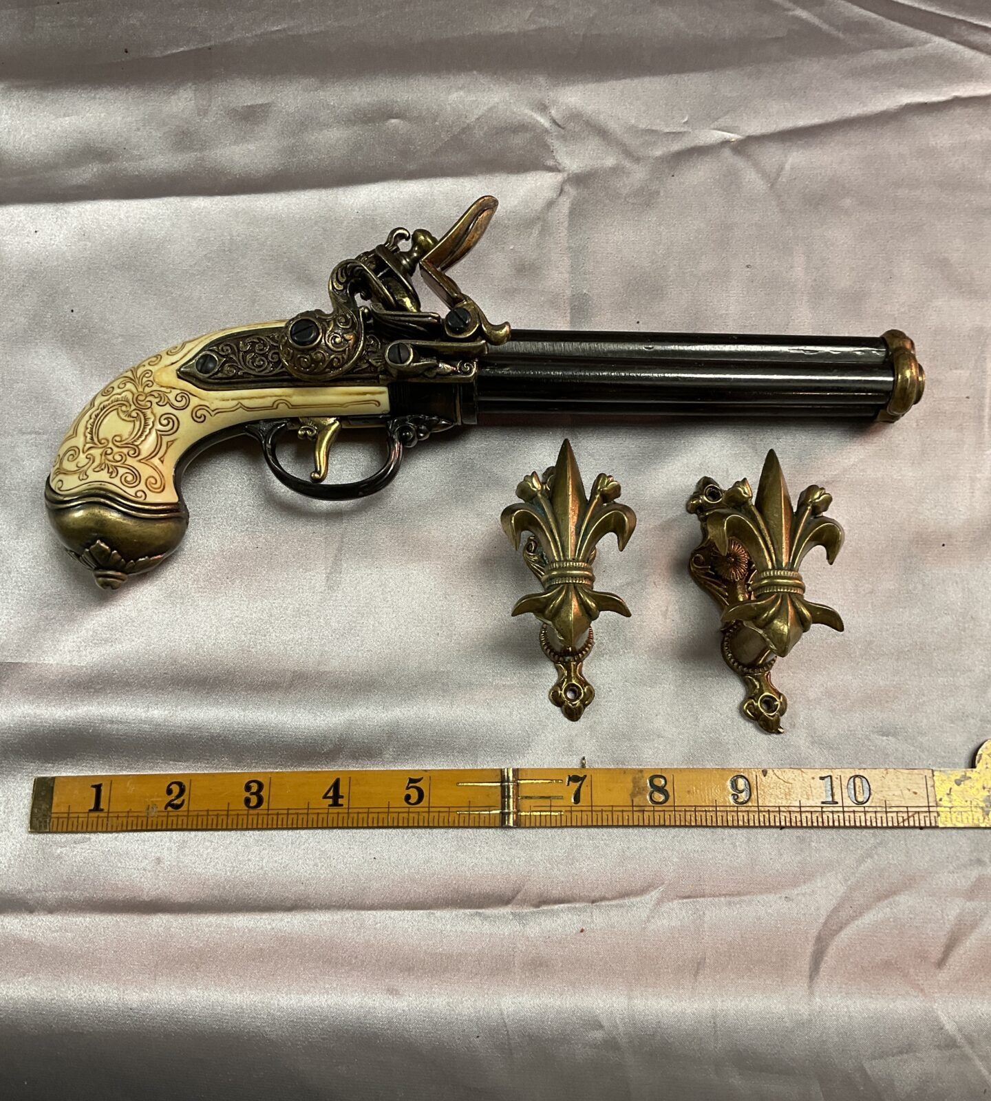 Reproduction Italian 1680 three barrel flintlock pistol with wall brackets