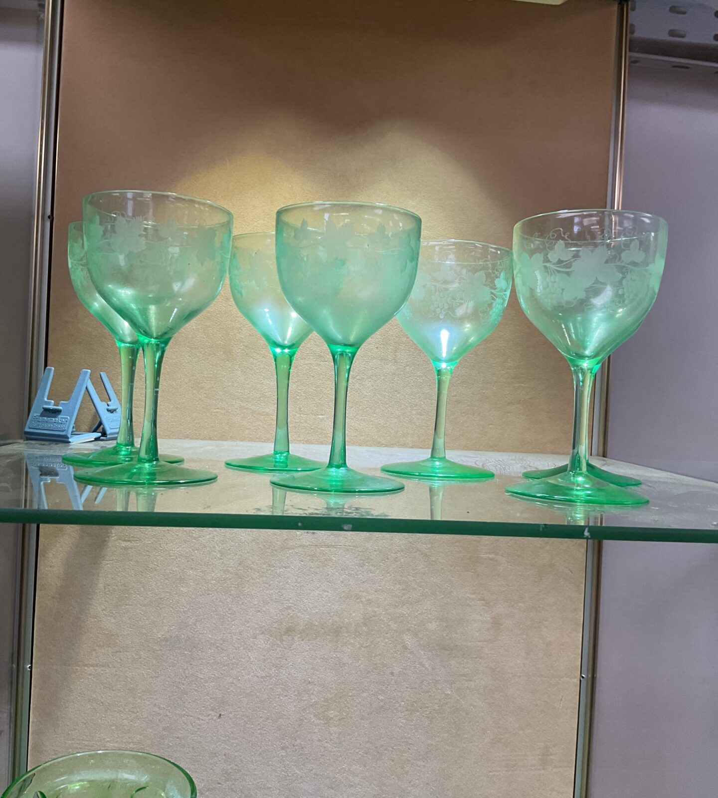 Seven hand engraved green uranium wine glasses