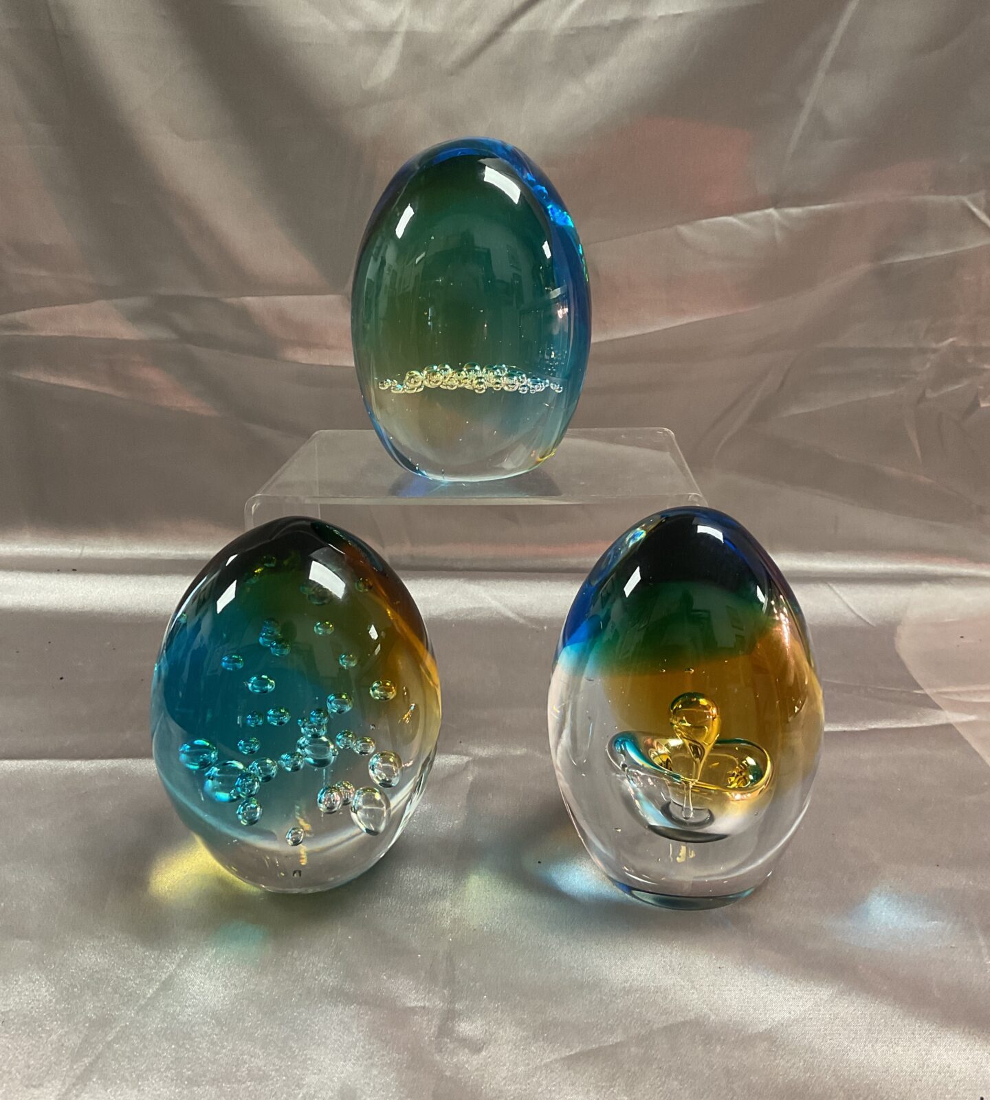 Three matching Glass paperweights