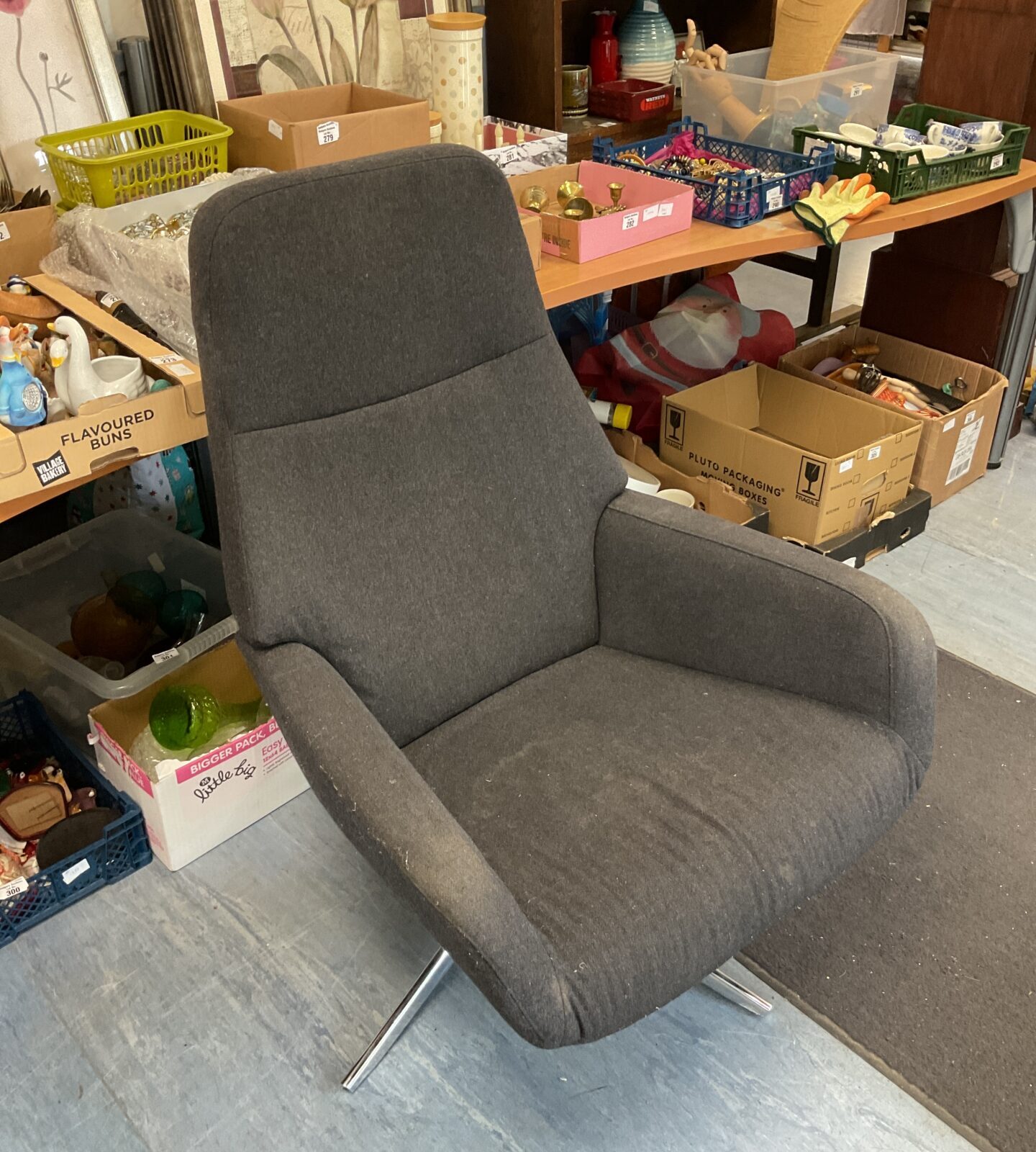 Grey fabric swivel armchair