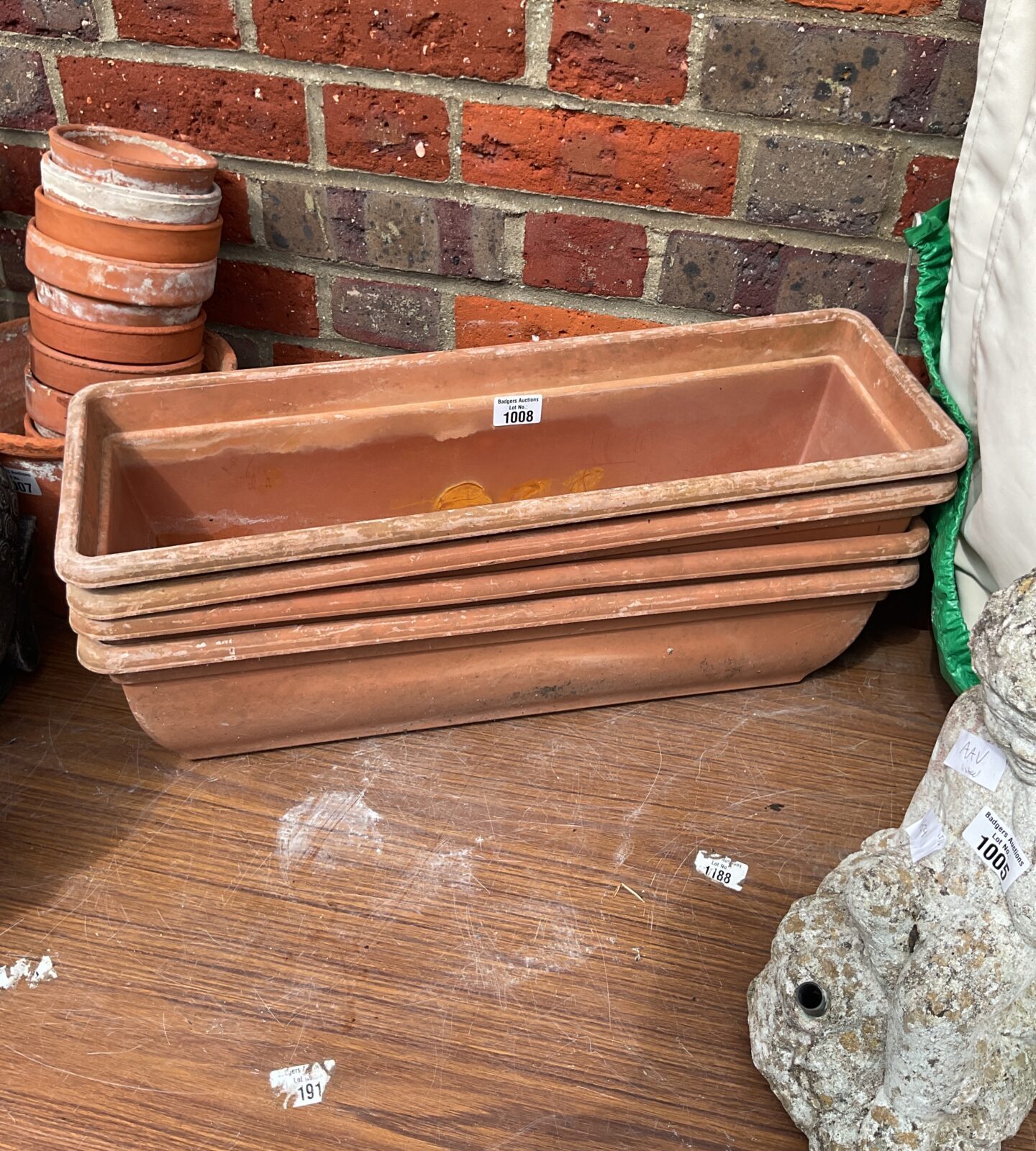 Four plastic garden planters