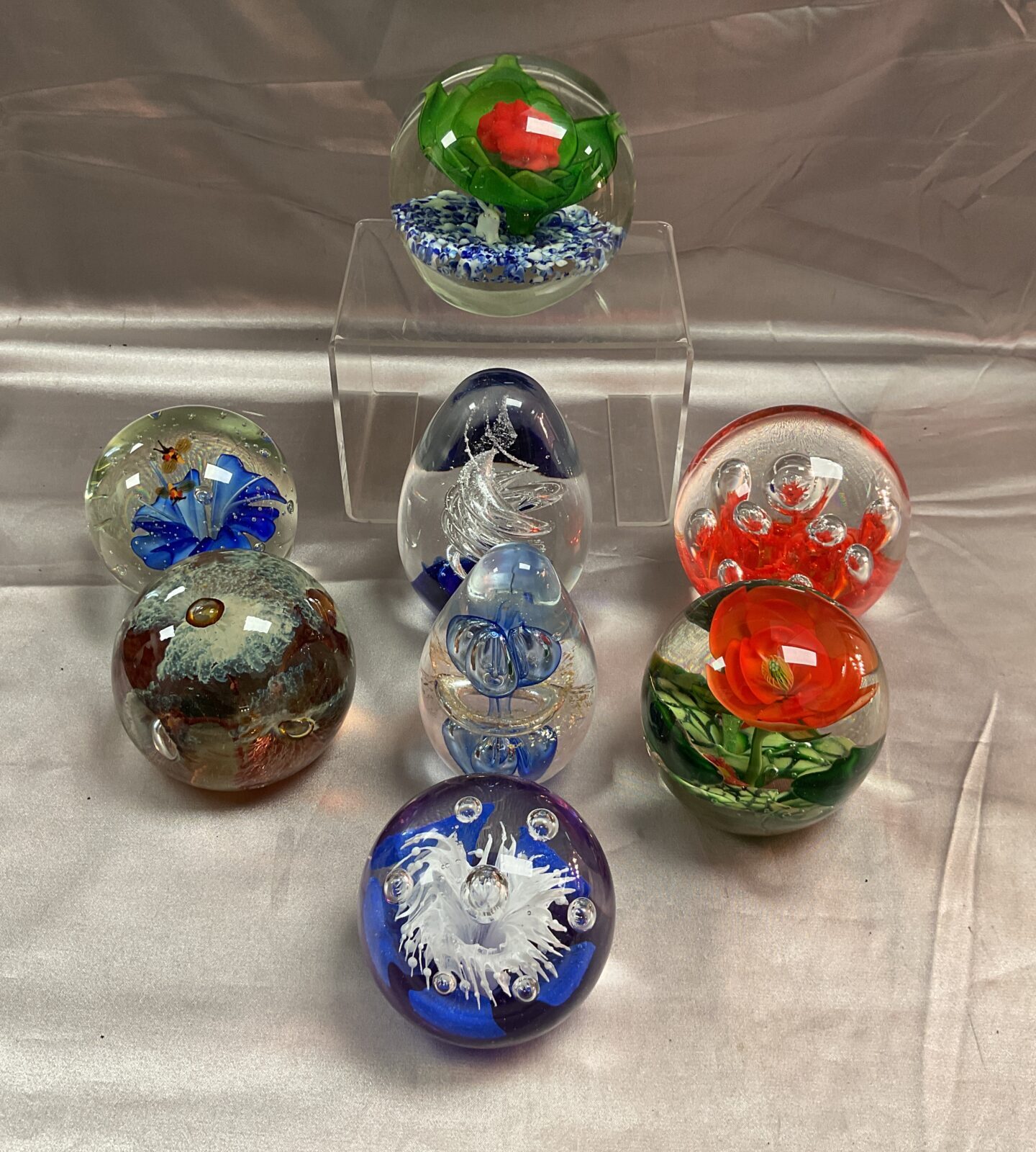 Eight assorted glass paperweights