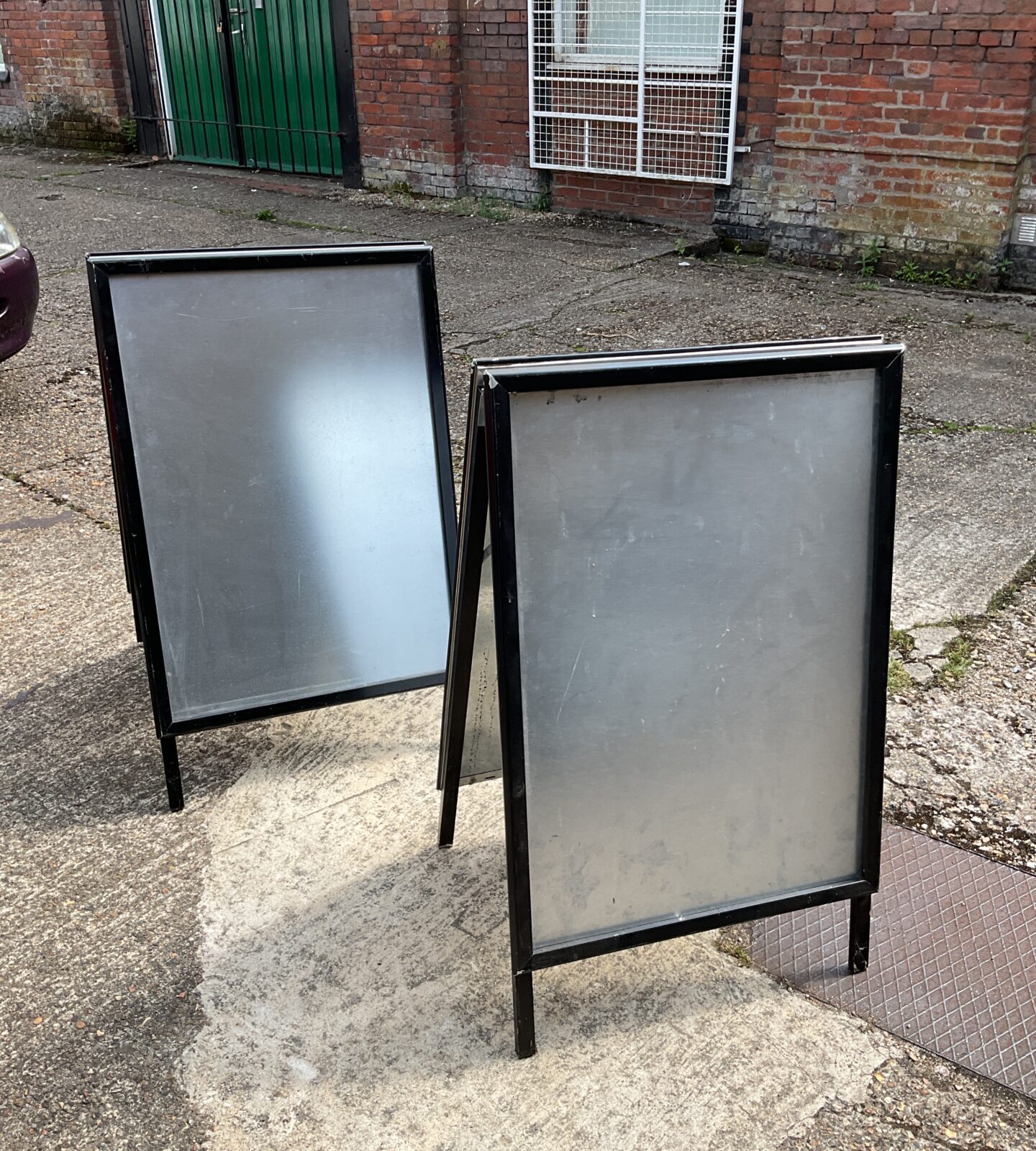 Two advertising a boards